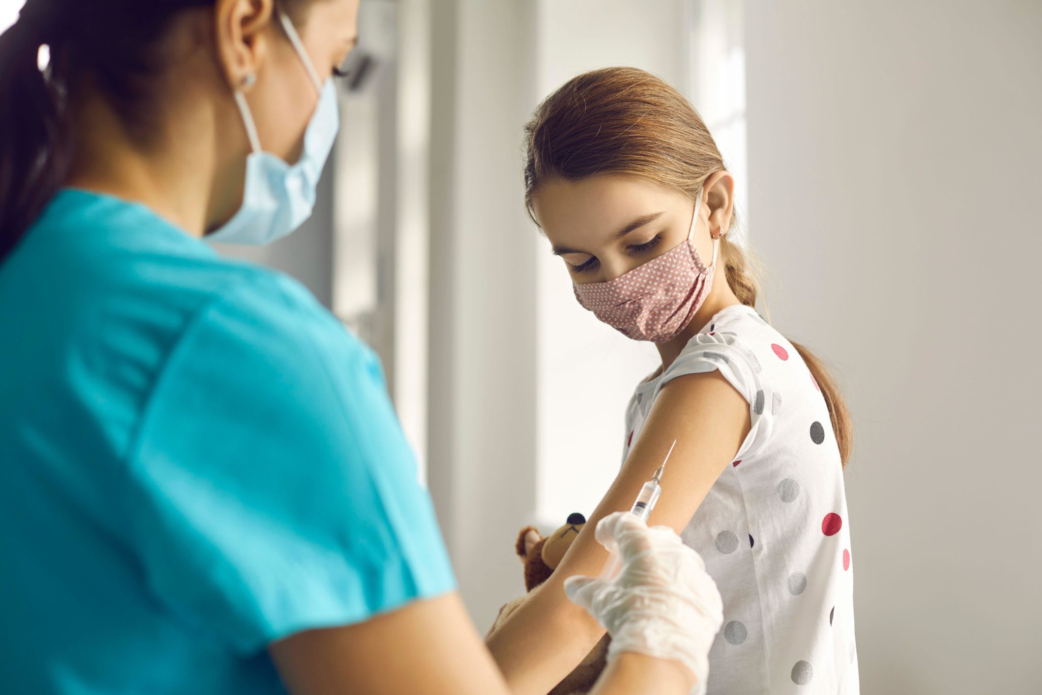 A child getting a vaccine shot at the doctor's office. Image: Roman Lacheev / Alamy Stock Photo