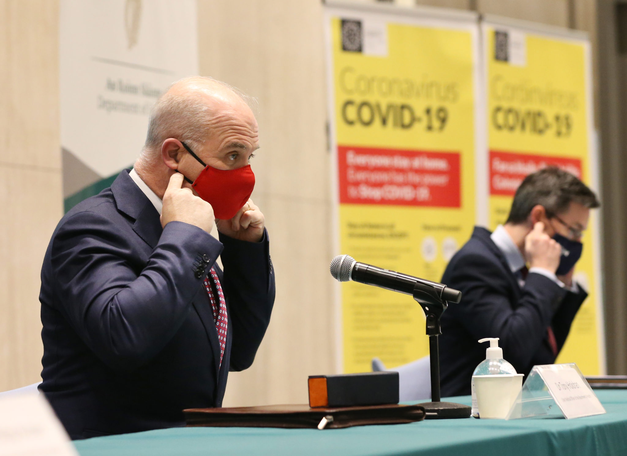 Dr Tony Holohan, Chief Medical Officer, and Dr Ronan Glynn, Deputy Chief Meidcal Officer, wearing face masks at a media briefing at the Department of Health in February 2021.