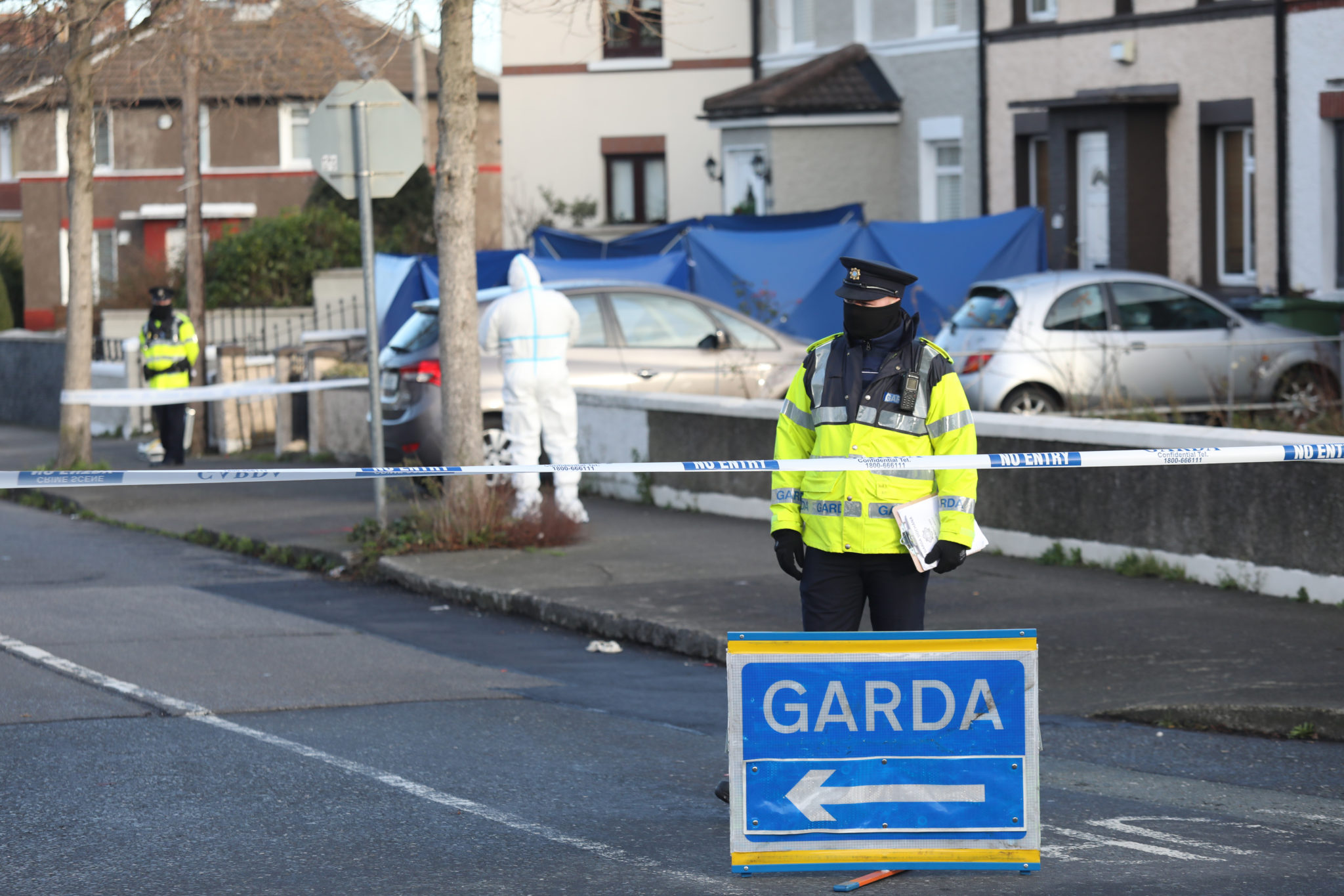 Garda forensic investigators examine the scene 49-year-old Michael Tormey was shot dead in Ballyfermot, Dublin