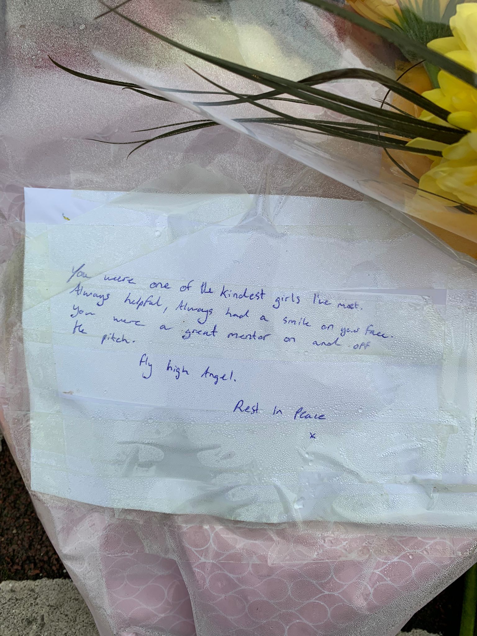 A note on a bouquet of flowers left at the scene where Ashling Murphy was killed