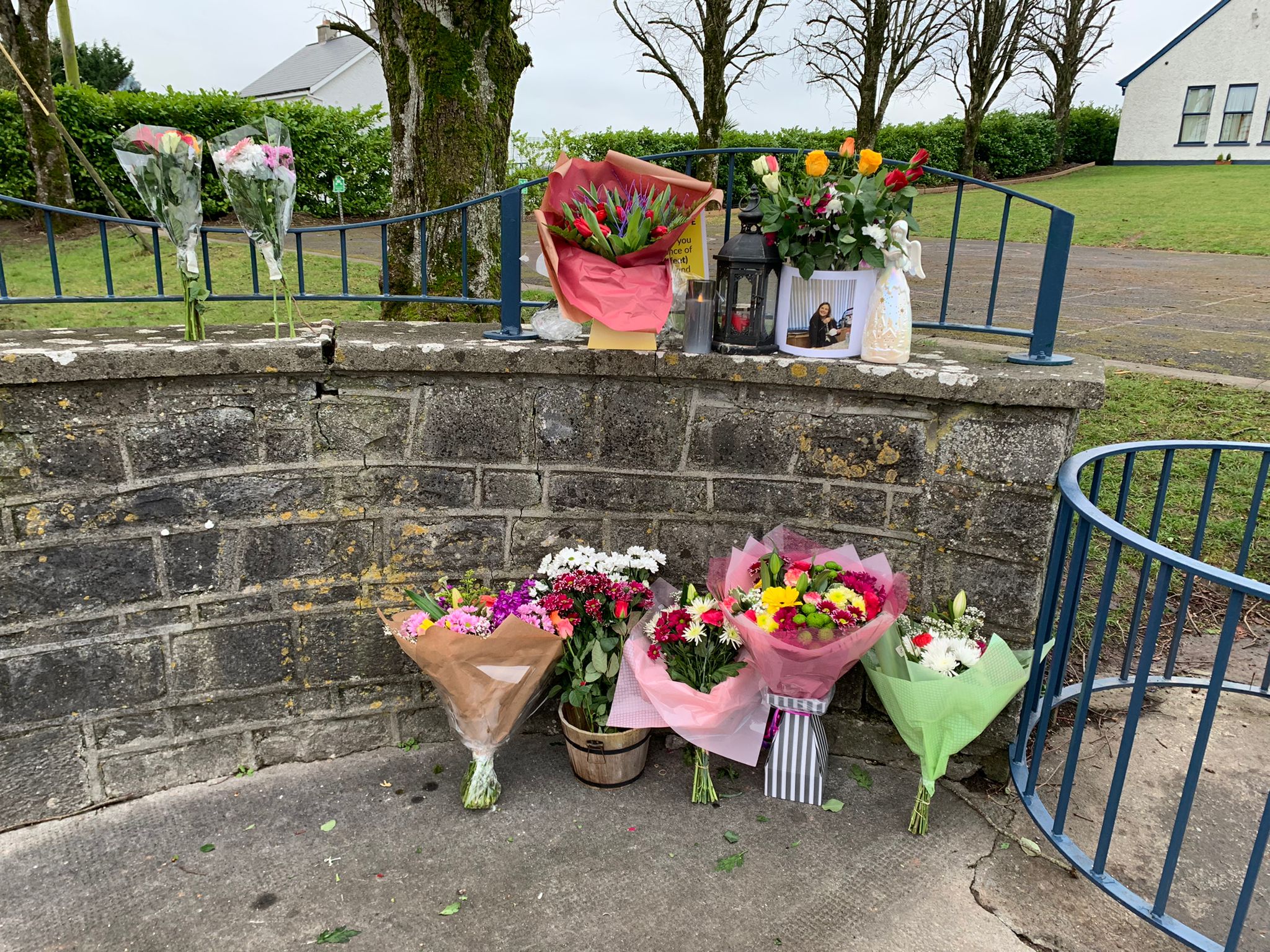 Flowers are left outside Durrow National School in Tullamore, Co Offaly in tribute to Ashling Murphy