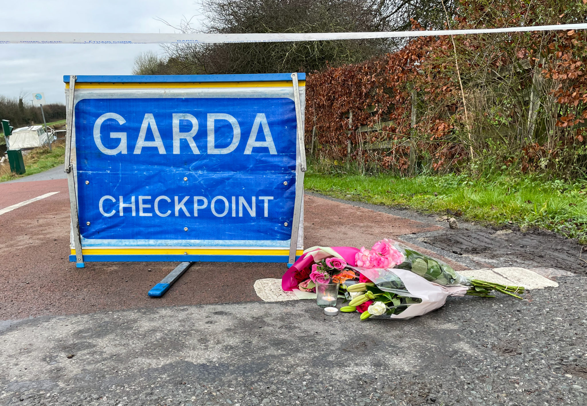 13/01/2022 Covid-19 Pandemic (Coronavirus), Ireland. Day 659 since start of lockdown. Day 249 of eased restrictions. Pictured are flowers left beside a Garda checkpoint at the Grand Canal Towpath, Capancur, Offally, near the scene of the fatal assault on Ashling Murphy which occurred yesterday afternoon. Photograph: Eamonn Farrell / RollingNews.ie