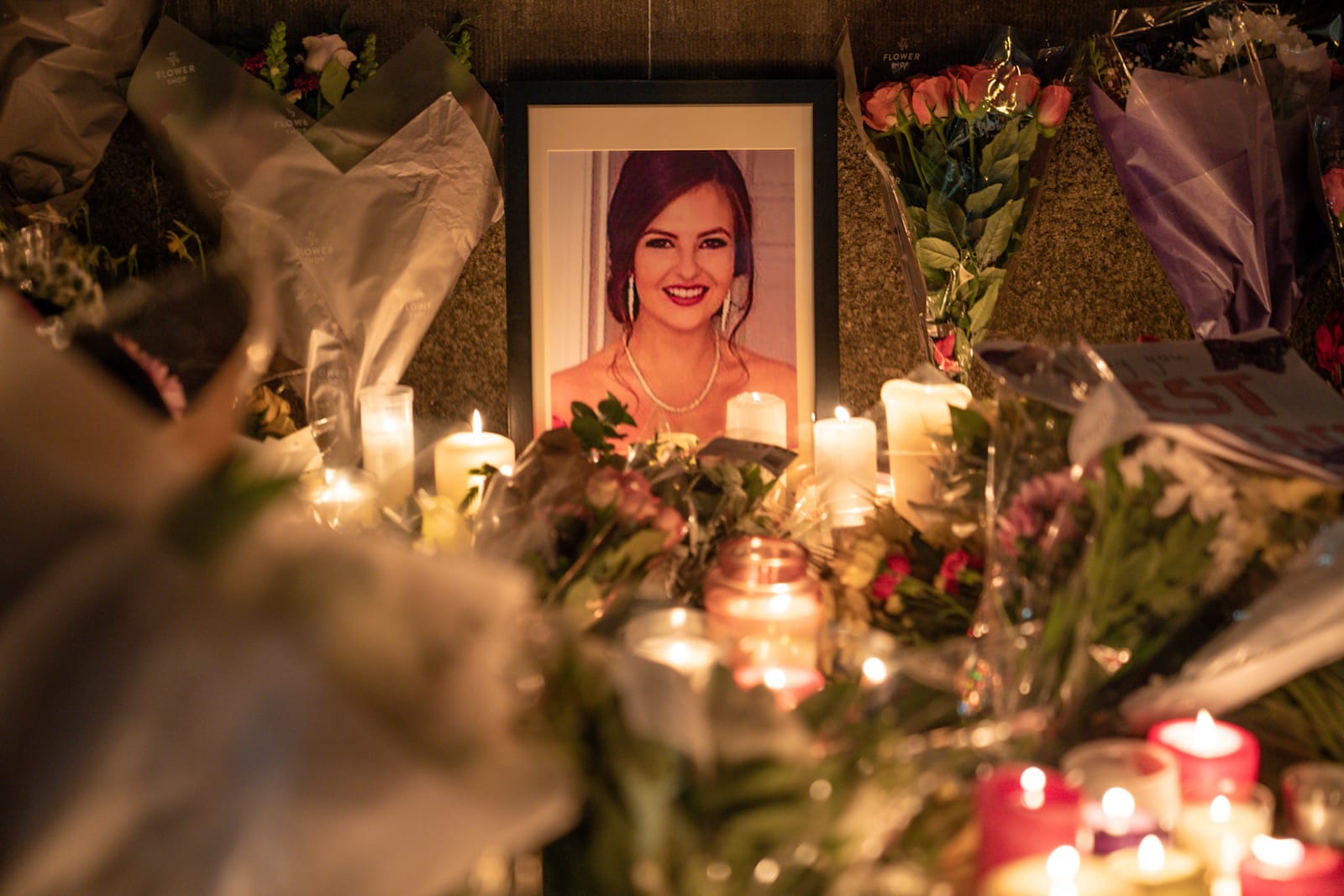 Candle and floral tributes are left beside the Dáil in Dublin city