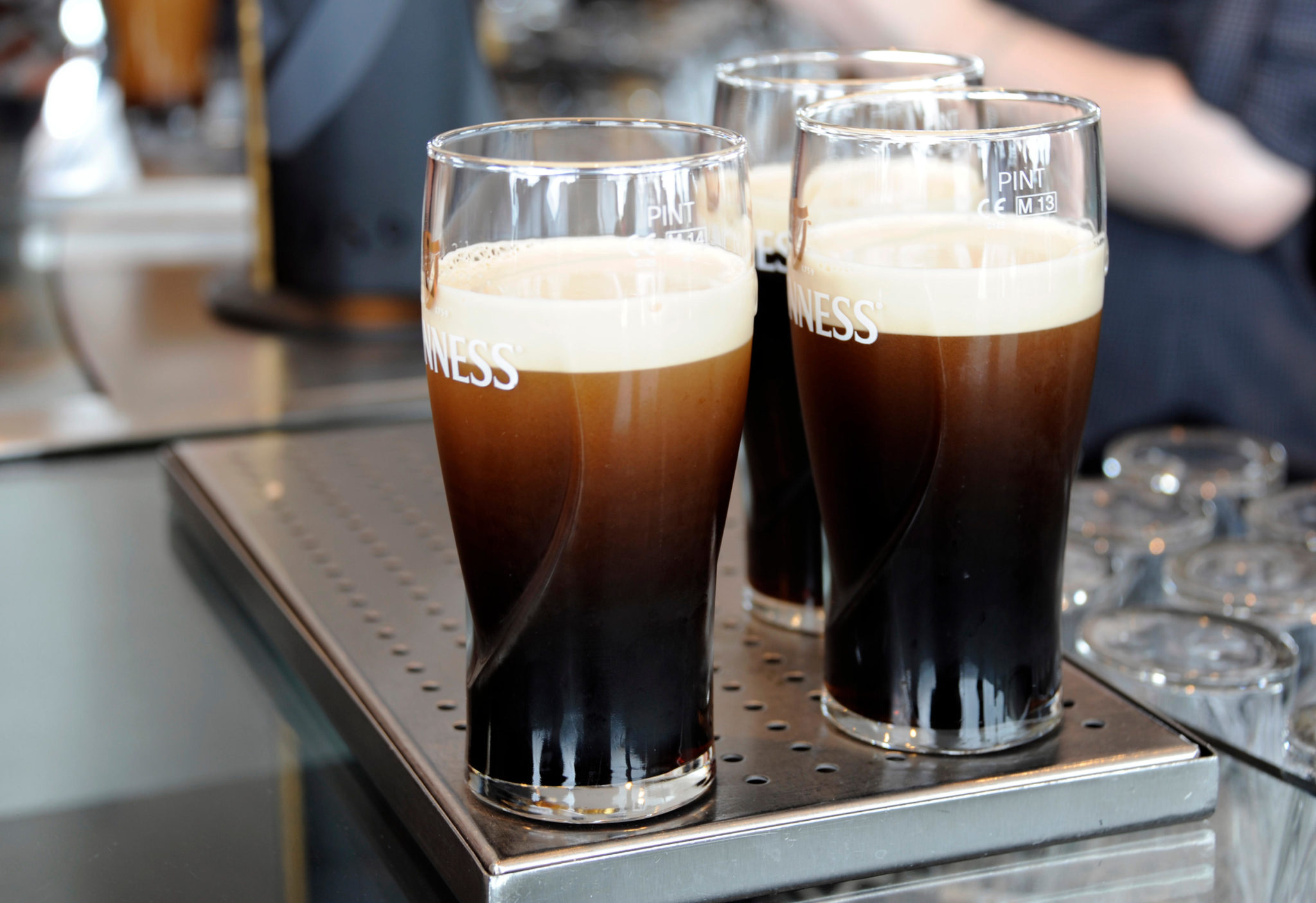 Pints of Guinness being prepared