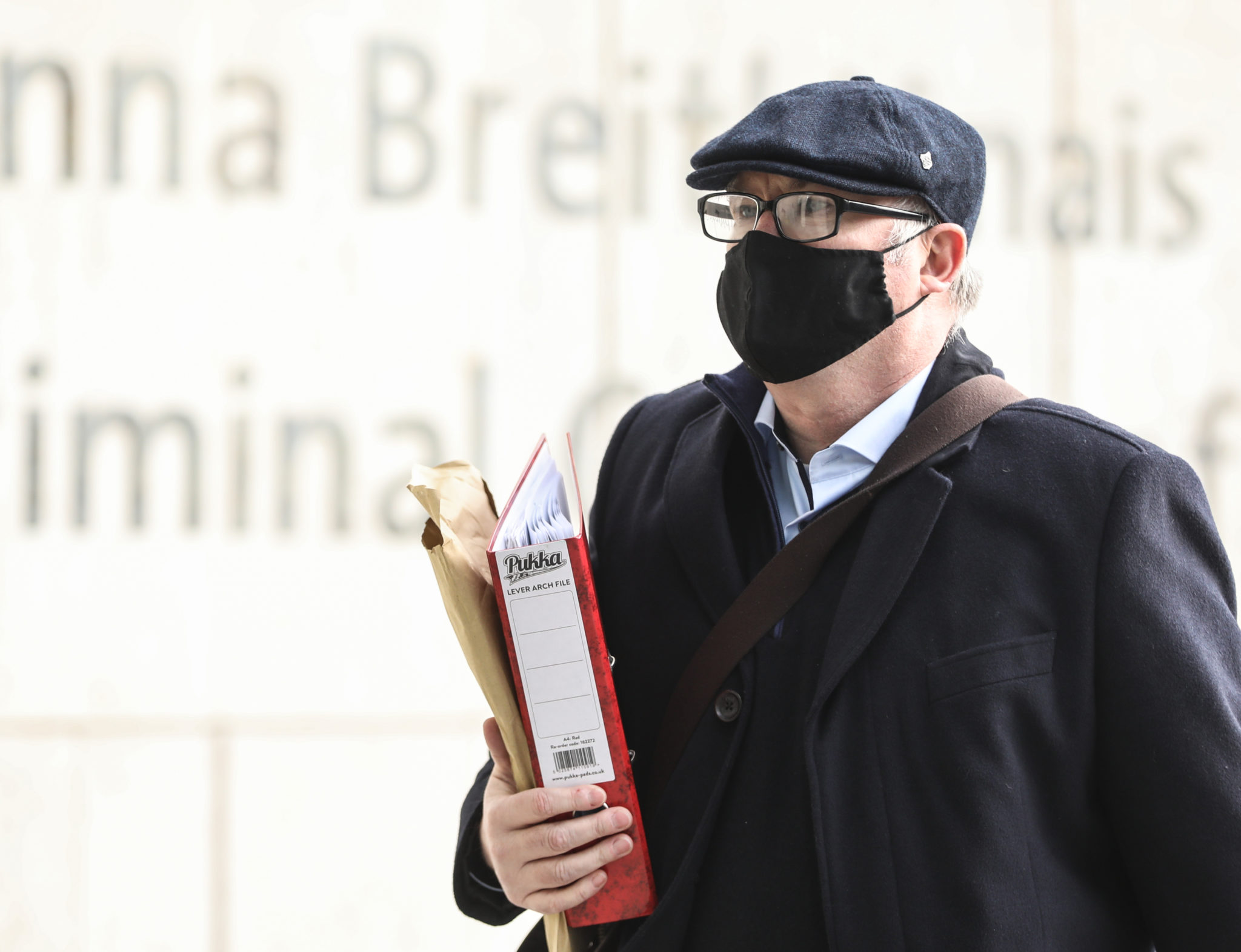 Former solicitor Michael Lynn wearing a face mask while arriving at the Criminal Courts of Justice