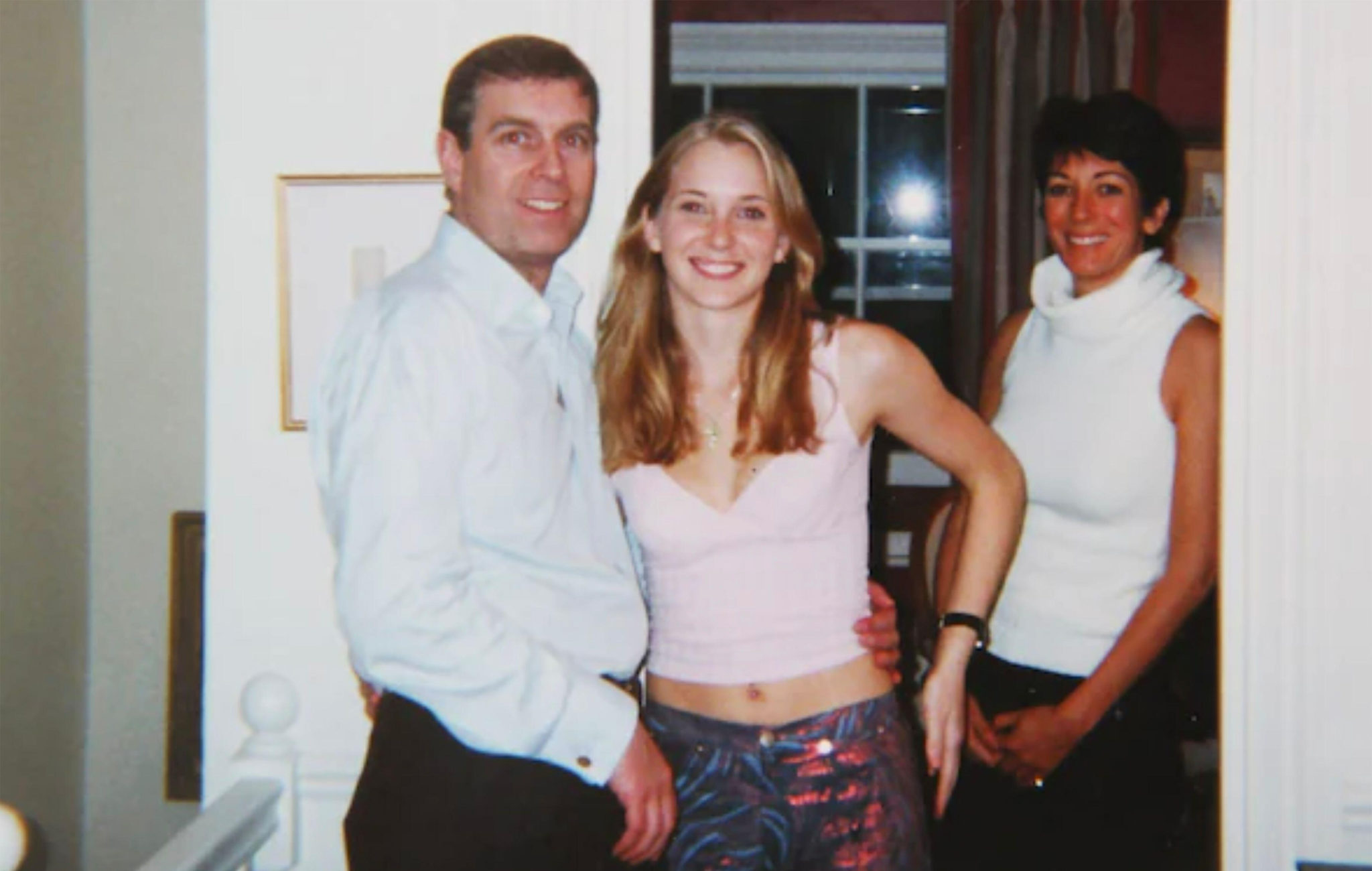 Britain’s Prince Andrew with Virginia Giuffre centre and Ghislaine Maxwell.