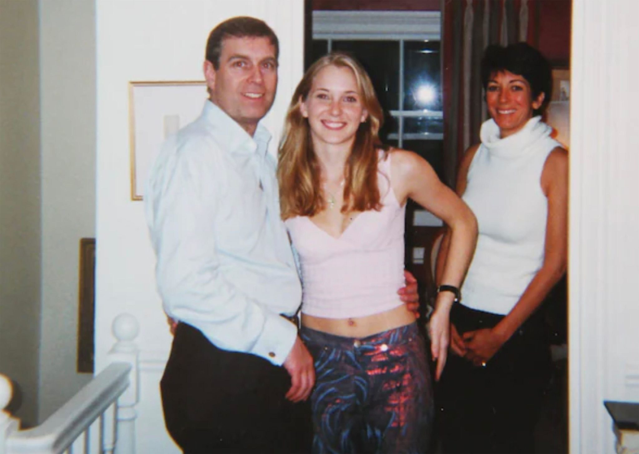 Britain’s Prince Andrew with Virginia Giuffre centre and Ghislaine Maxwell