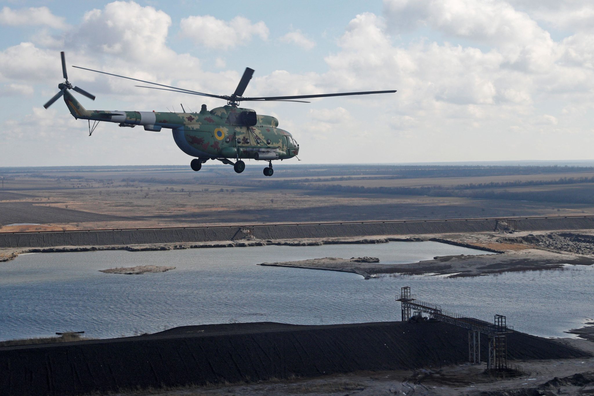 A military helicopter of Ukrainian Armed Forces flies over the Donetsk region