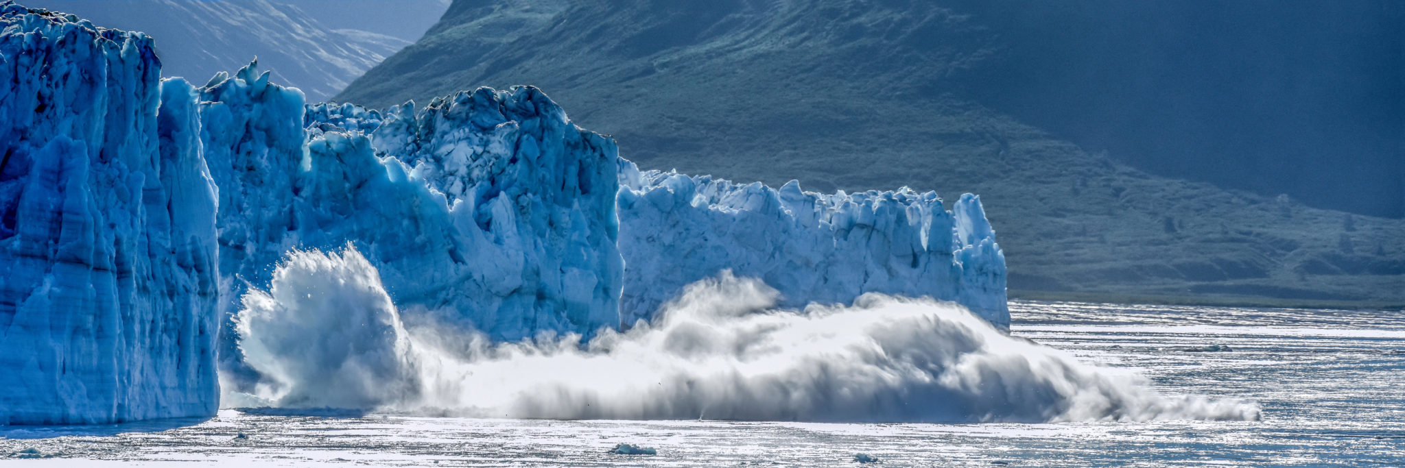 Alaska cruise - calving glacier - Hubbard - global warming & climate change - a melting iceberg calves - St. Elias Alaska - Yukon, Canada