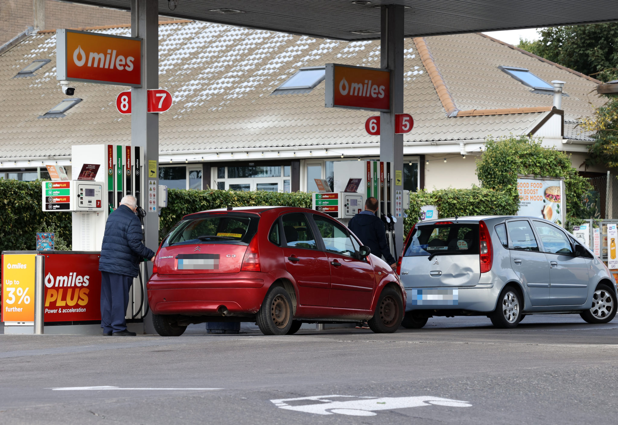 A man filling his car at a petrol pump at a Q Miles station in Dublin.
