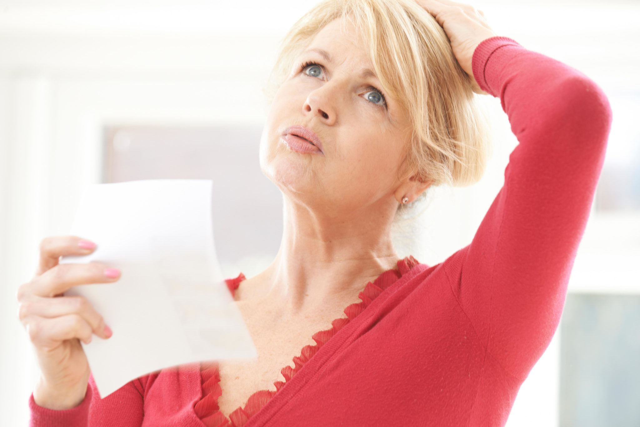 A woman experiencing a hot flush From menopause