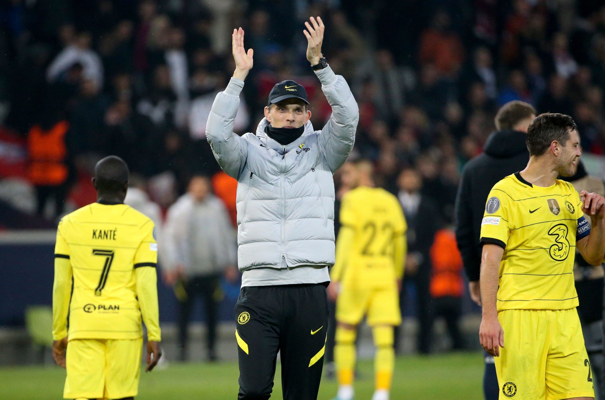 Thomas Tuchel applauds the fans after Chelsea progress in the Champions League against Lille