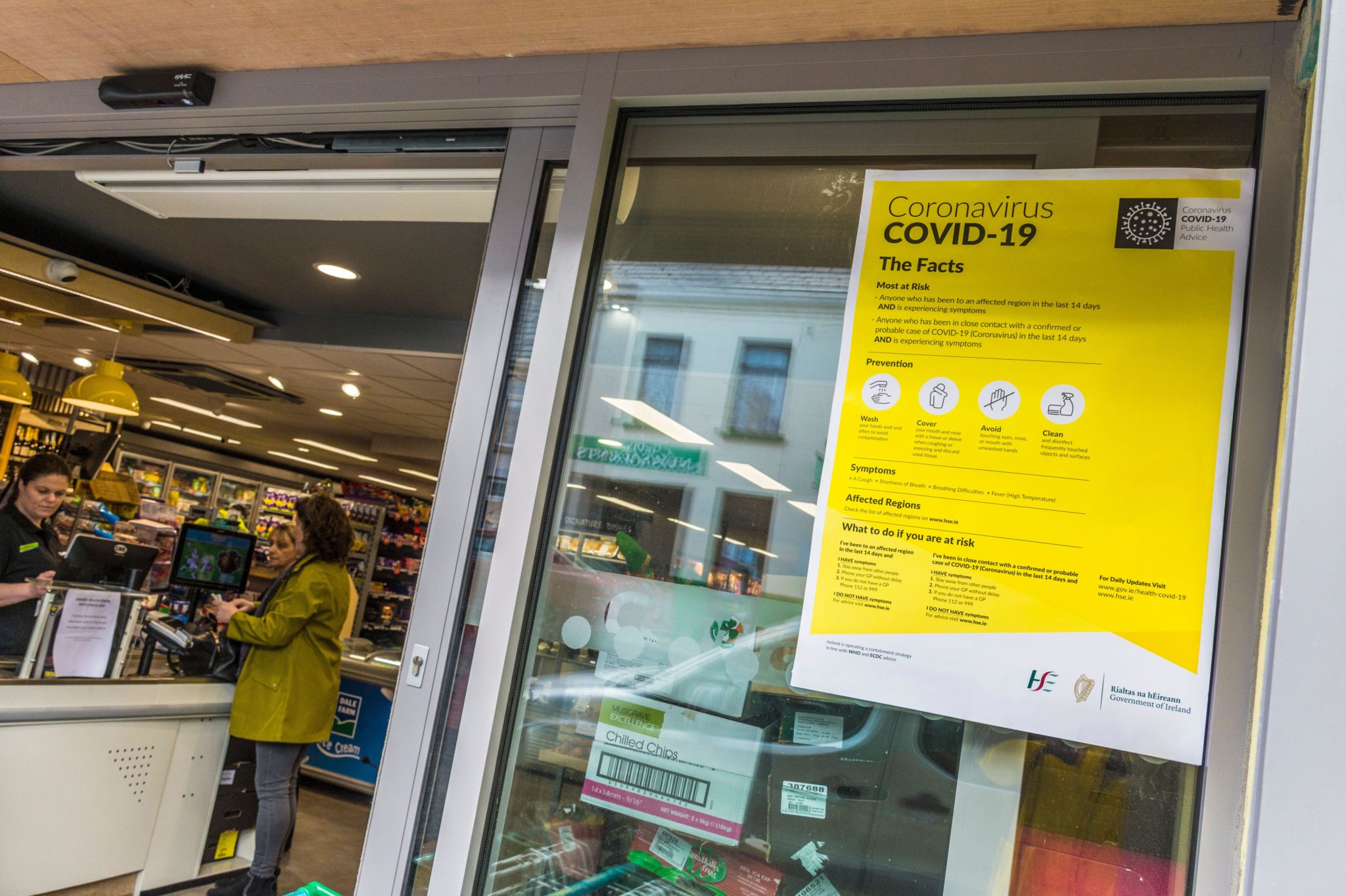 A HSE notice explains measures to contain coronavirus outside a mini-supermarket in Ardara, Co Donegal in March 2020.