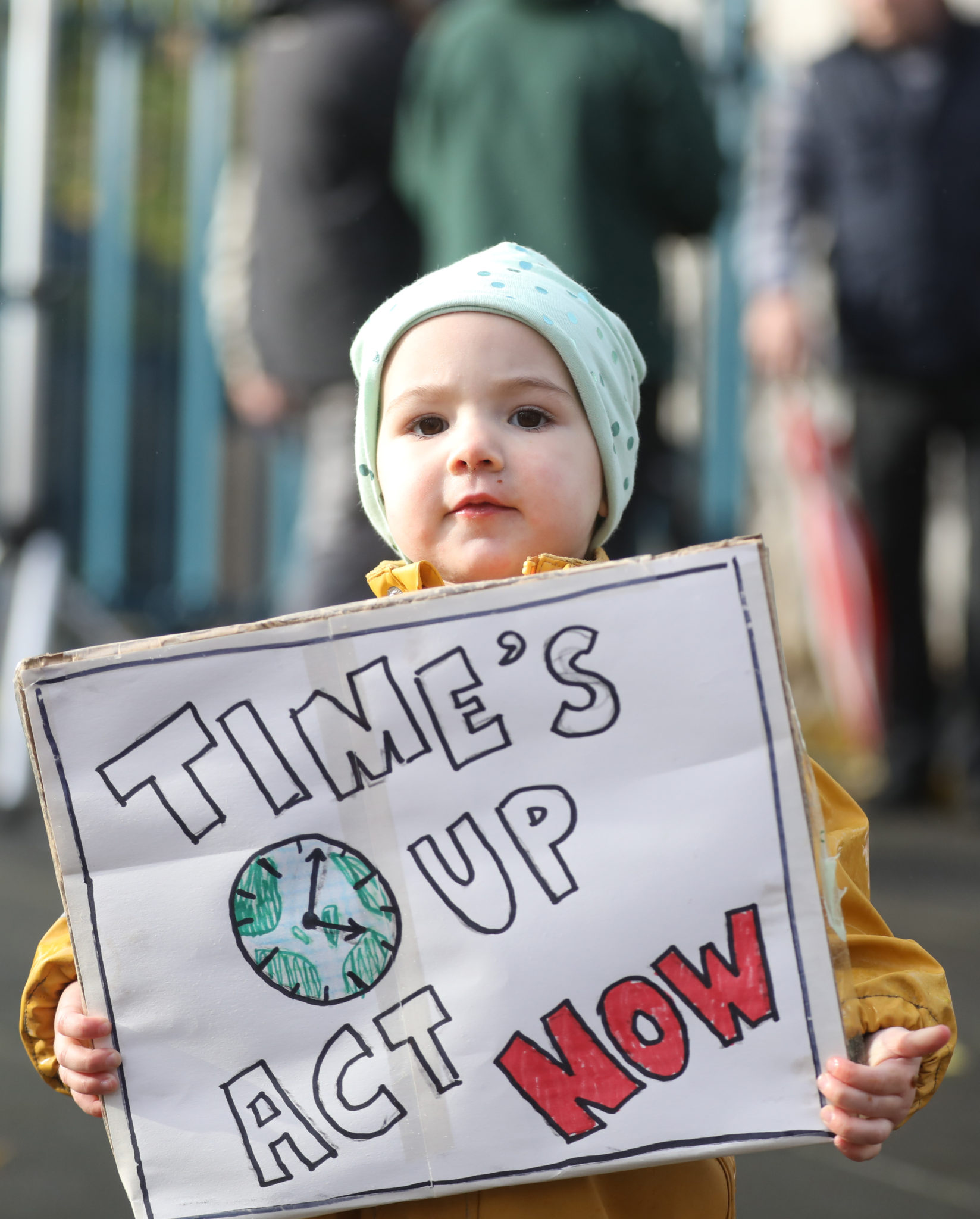 April Twyford-Hynes, aged 20 months, tells the World – ‘Time’s Up, Act Now,’ as she takes part in a Climate Action march in Dublin, 06-11-2021. Image: Leah Farrell/RollingNews
