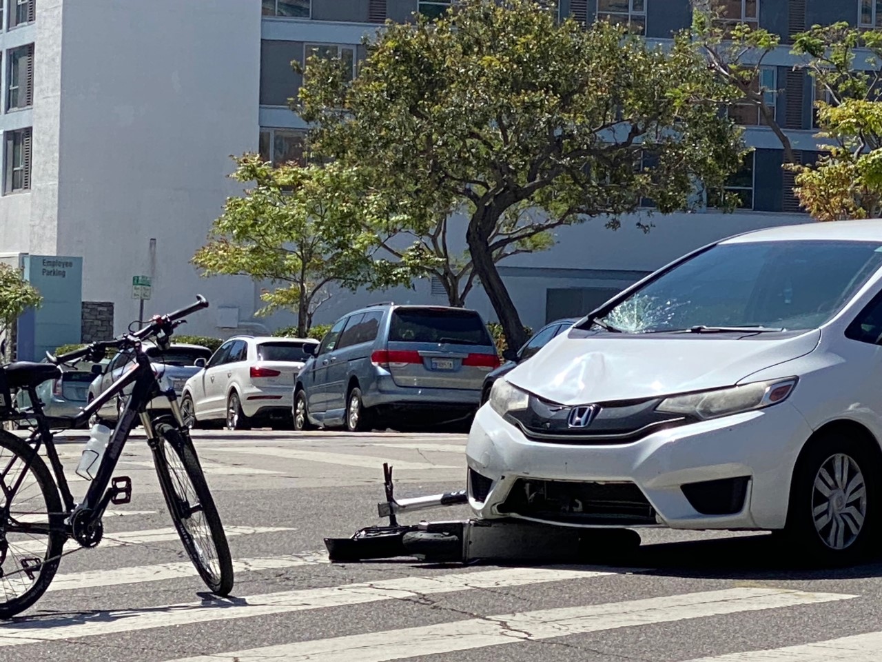 The aftermath of a collision between an e-scooter and a car. 