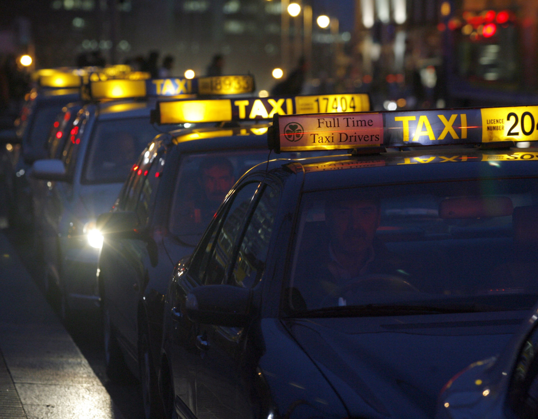 Taxis waiting for business along The Quays in Dublin in December 2008.