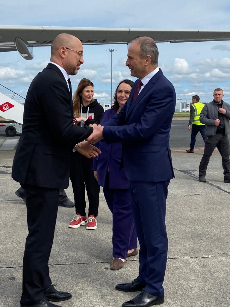 Ukrainian Prime Minister Denys Shmyhal and Taoiseach Micheál Martin greet each other at Shannon Airport