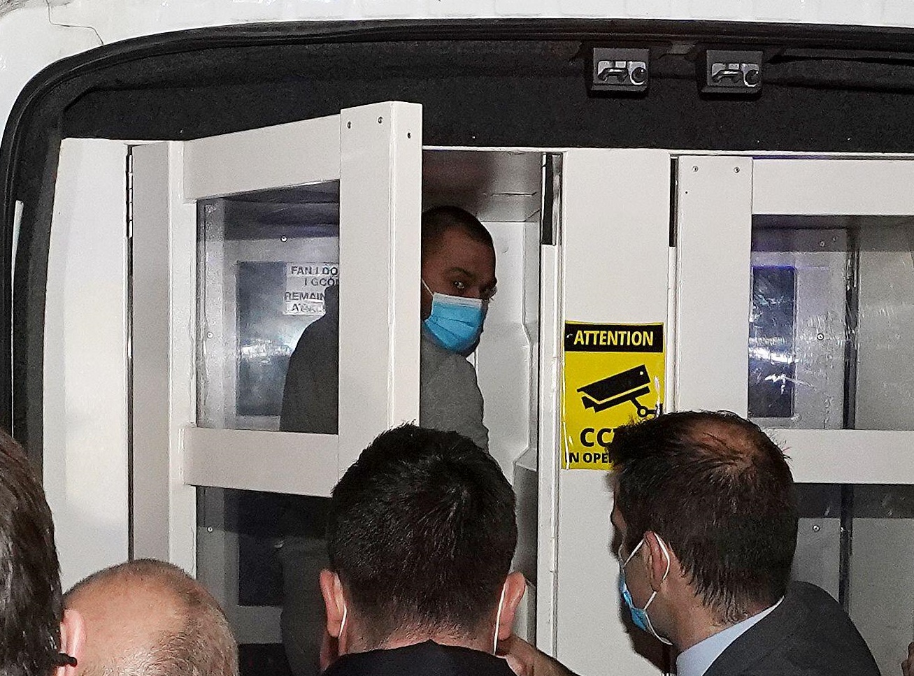 Jozef Puska (grey top with mask) is seen after appearing at Tullamore District Court in January 2022.