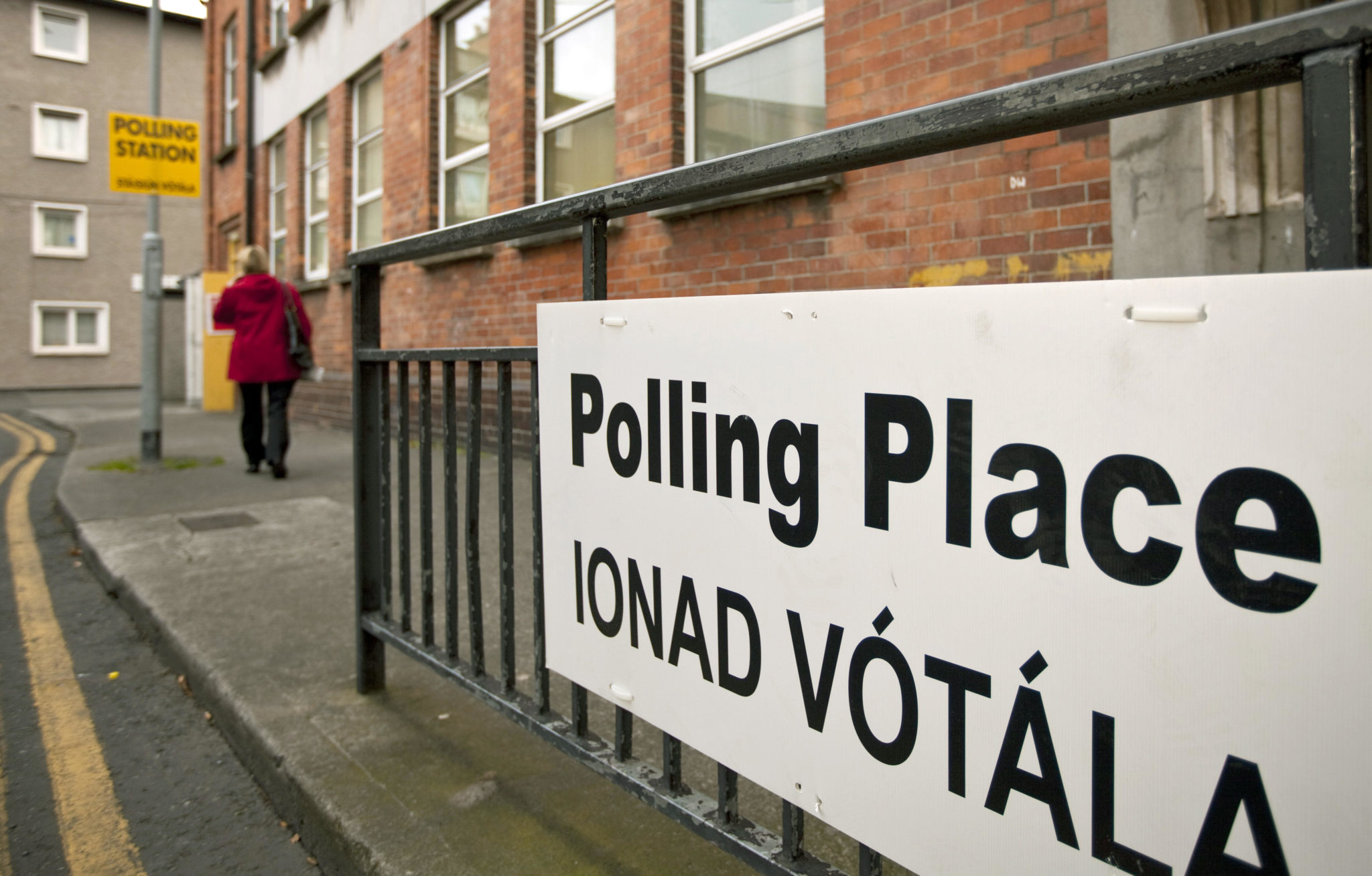 A sign in English and Irish points to a polling station in Dublin for the second EU referendum on the Treaty of Lisbon in October 2009