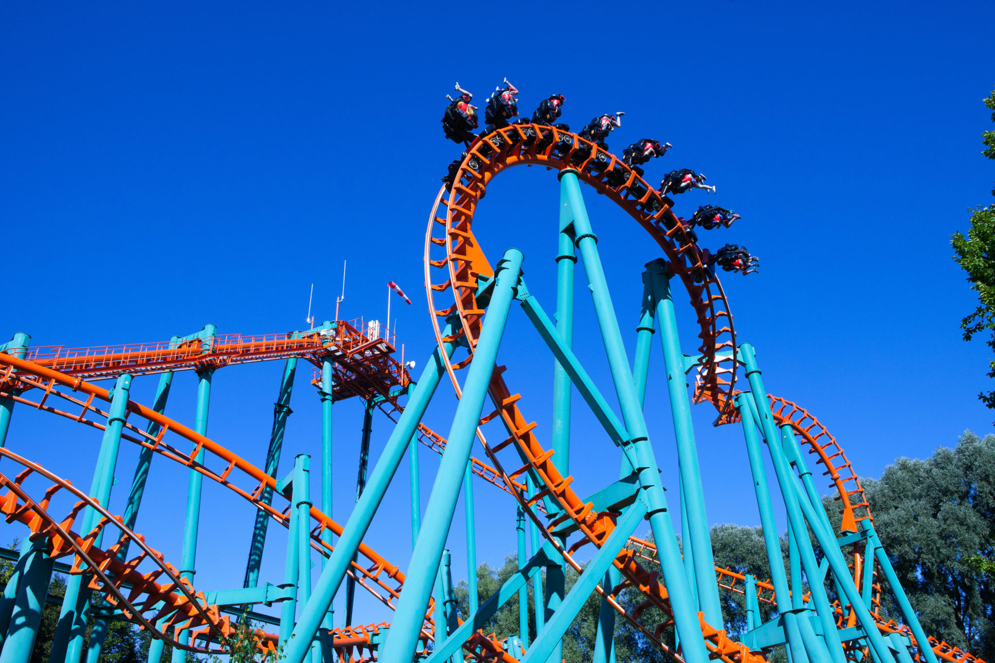 Orange rollercoaster with blue sky in the background. Image: StockStudio / Alamy Stock Photo 