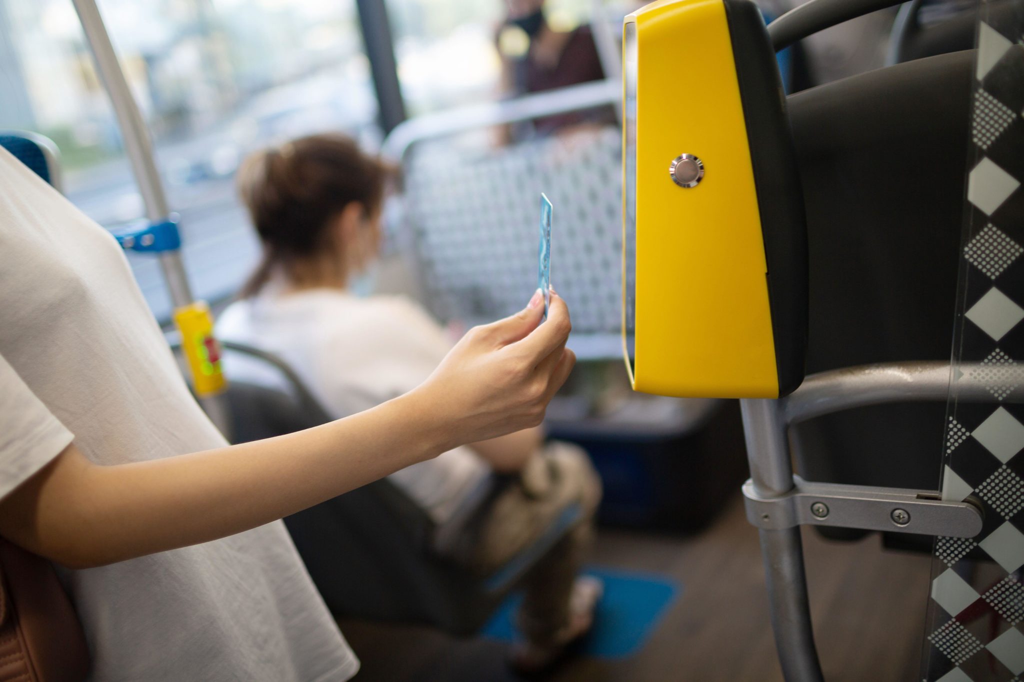 A woman paying for public transport through contactless. Image: Zoonar GmbH / Alamy Stock Photo