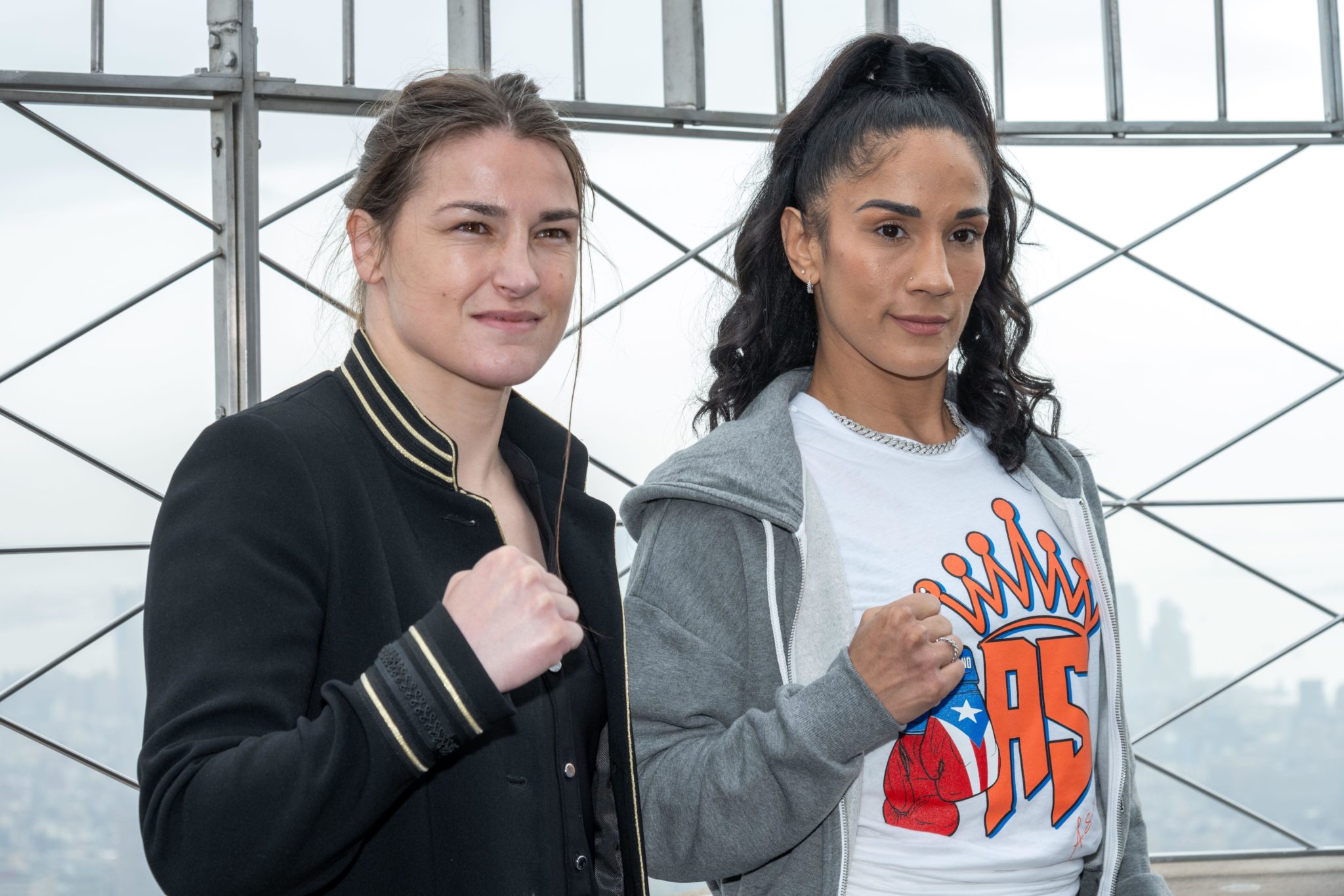 Katie Taylor (left) and Amanda Serrano of Puerto Rico pose during a promotional event at the observatory of the Empire State Building in New York, USA in April 2022. 