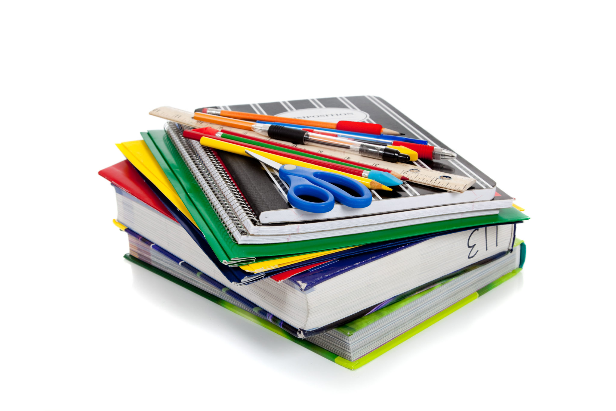 CXF6KM Stack of school books and supplies on a white background