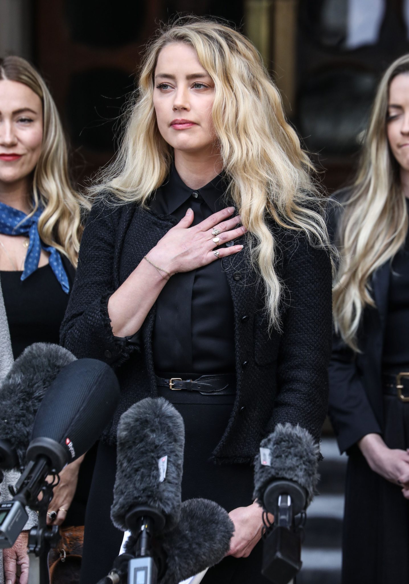 Amber Heard gives a statement outside the Royal Courts of Justice in London on the final day of the firs trial.