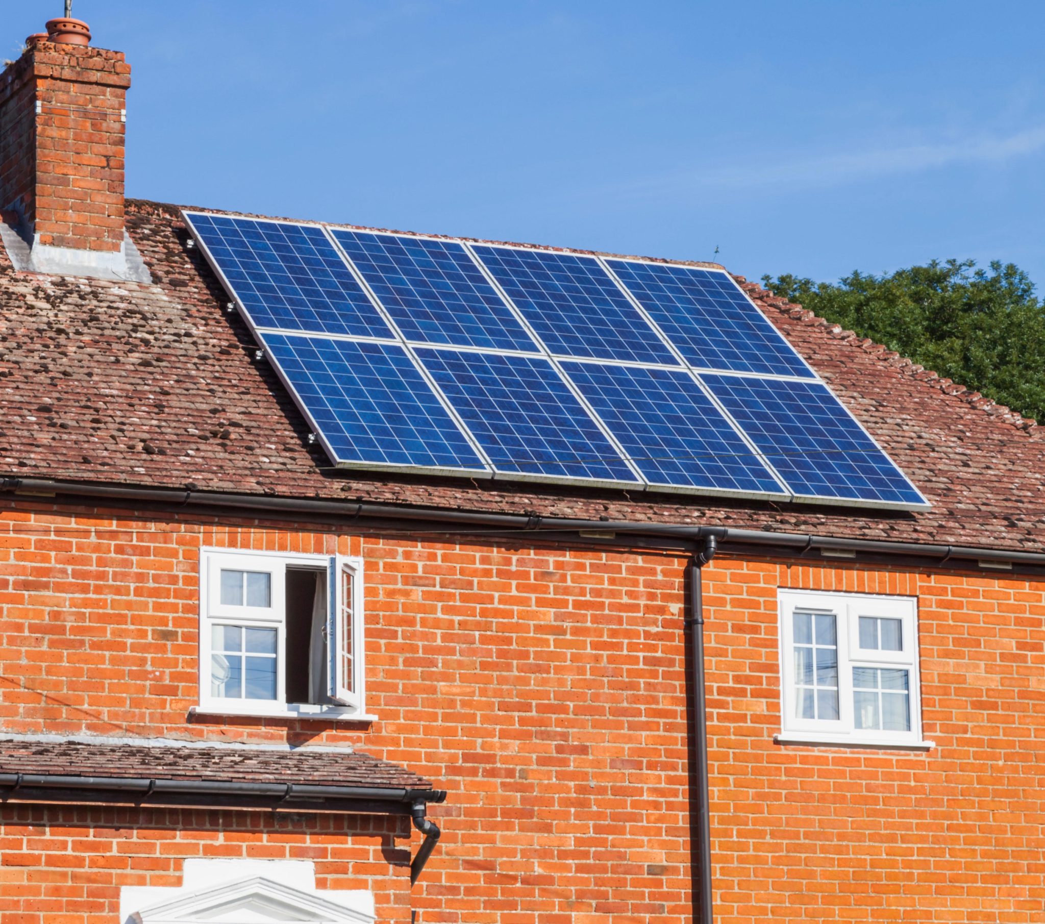 Rooftop solar panels are seen on a house in England, UK in August 2015.