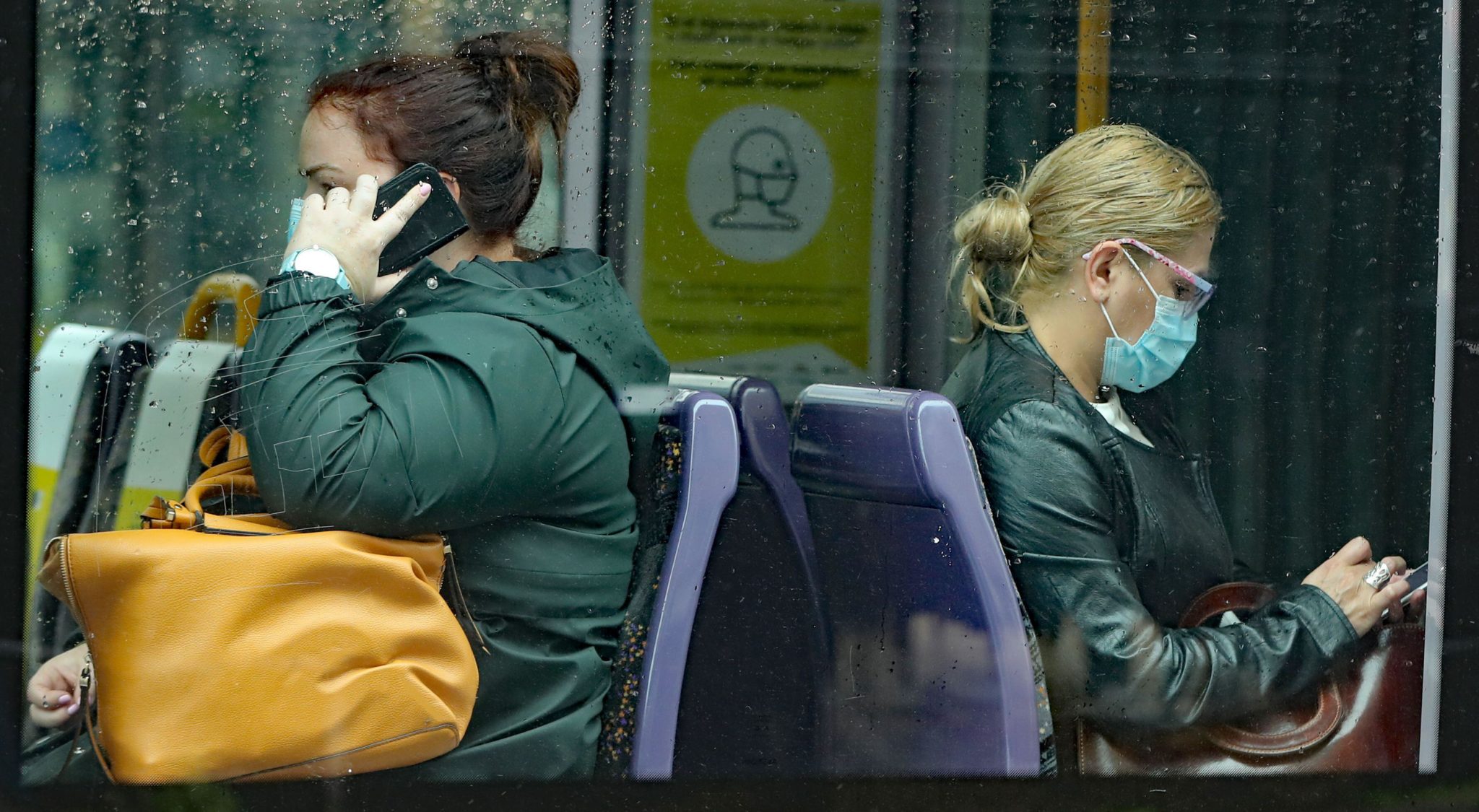 People wearing face coverings on a Luas tram in Dublin in July 2020