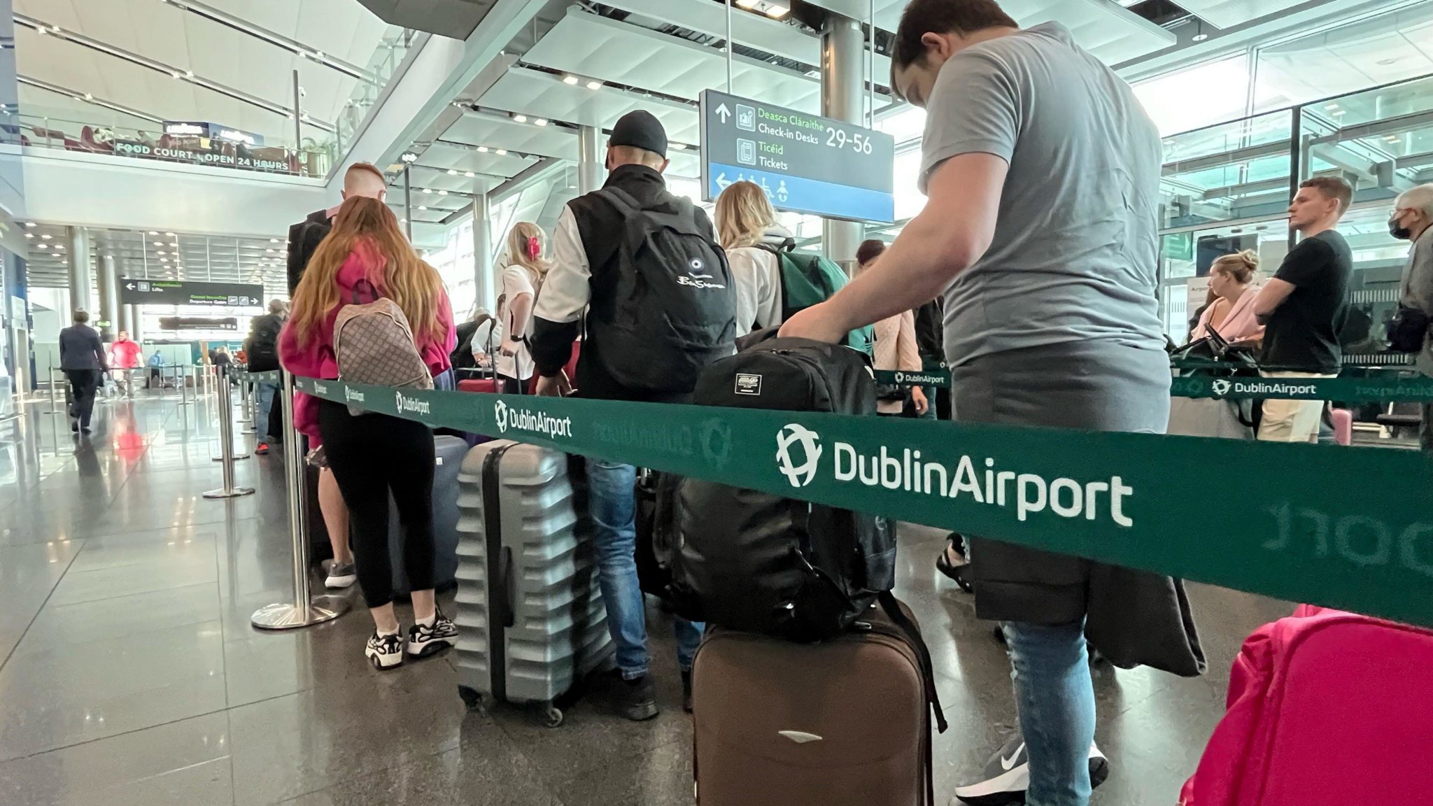 People queue inside Dublin Airport on May 31st 2022.