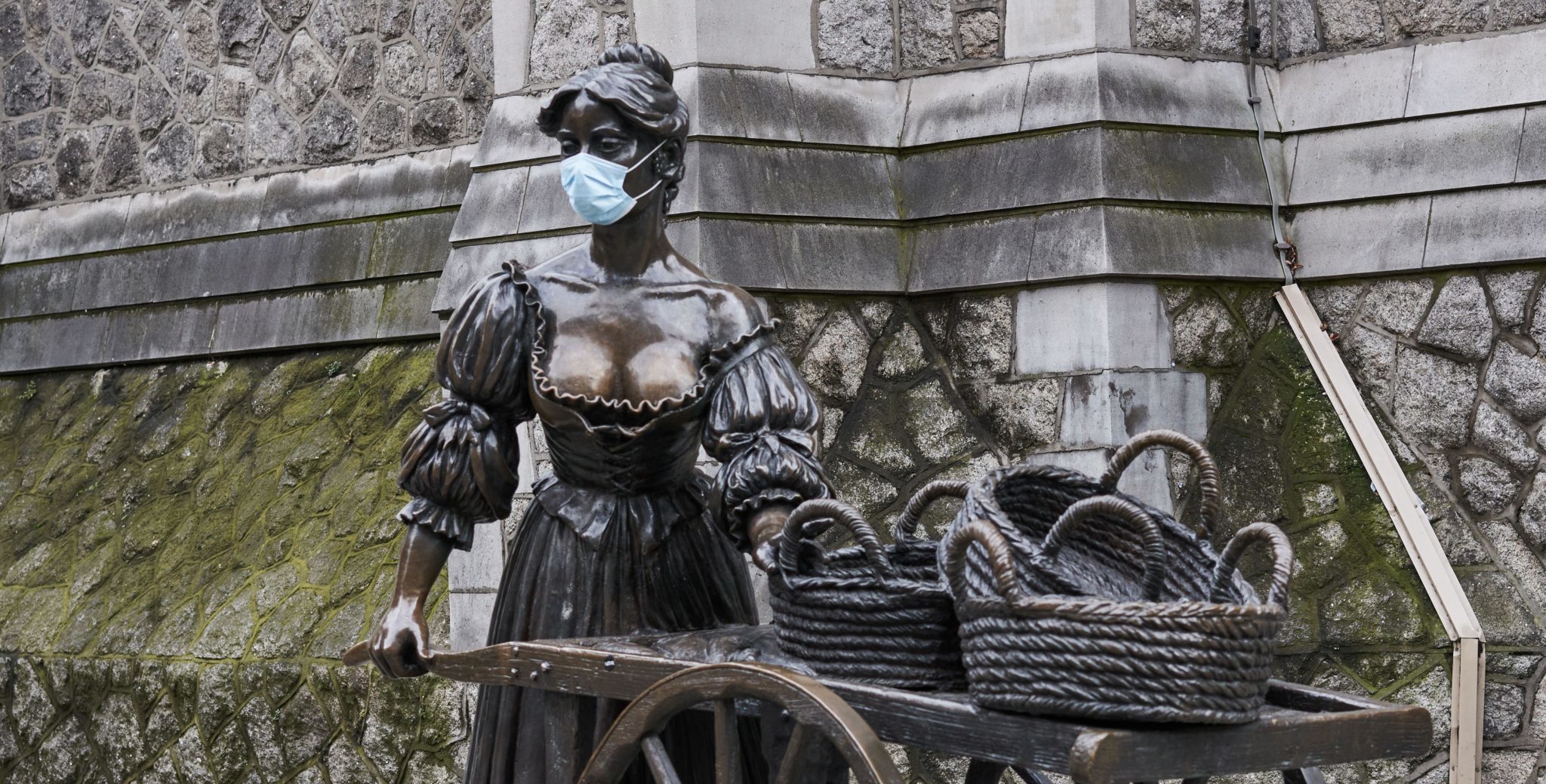 The Molly Malone statue in Dublin city with a facemask added during a coronavirus lockdown in November 2020.