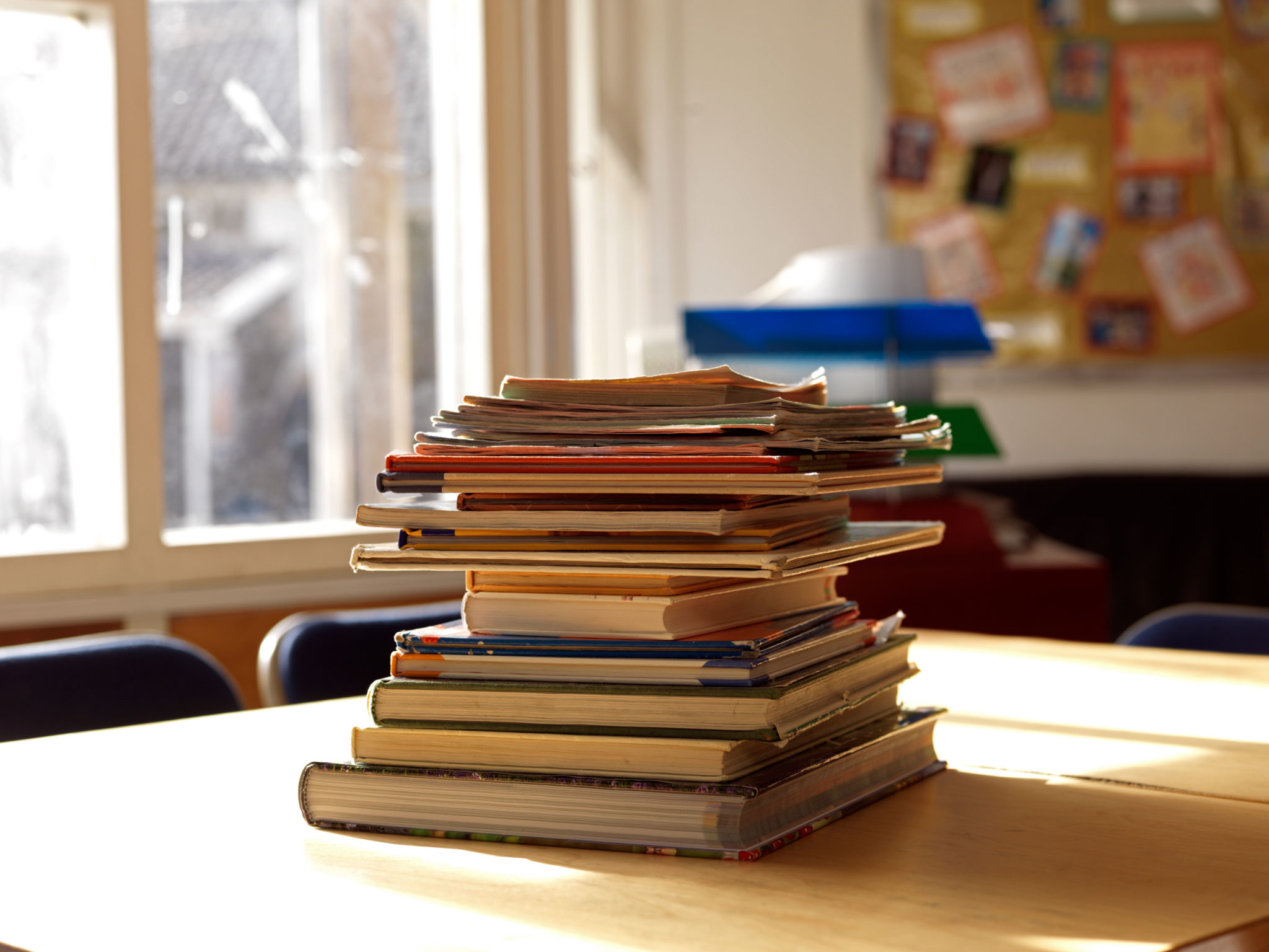 A pile of books in a classroom. Image: Alamy Stock Photo