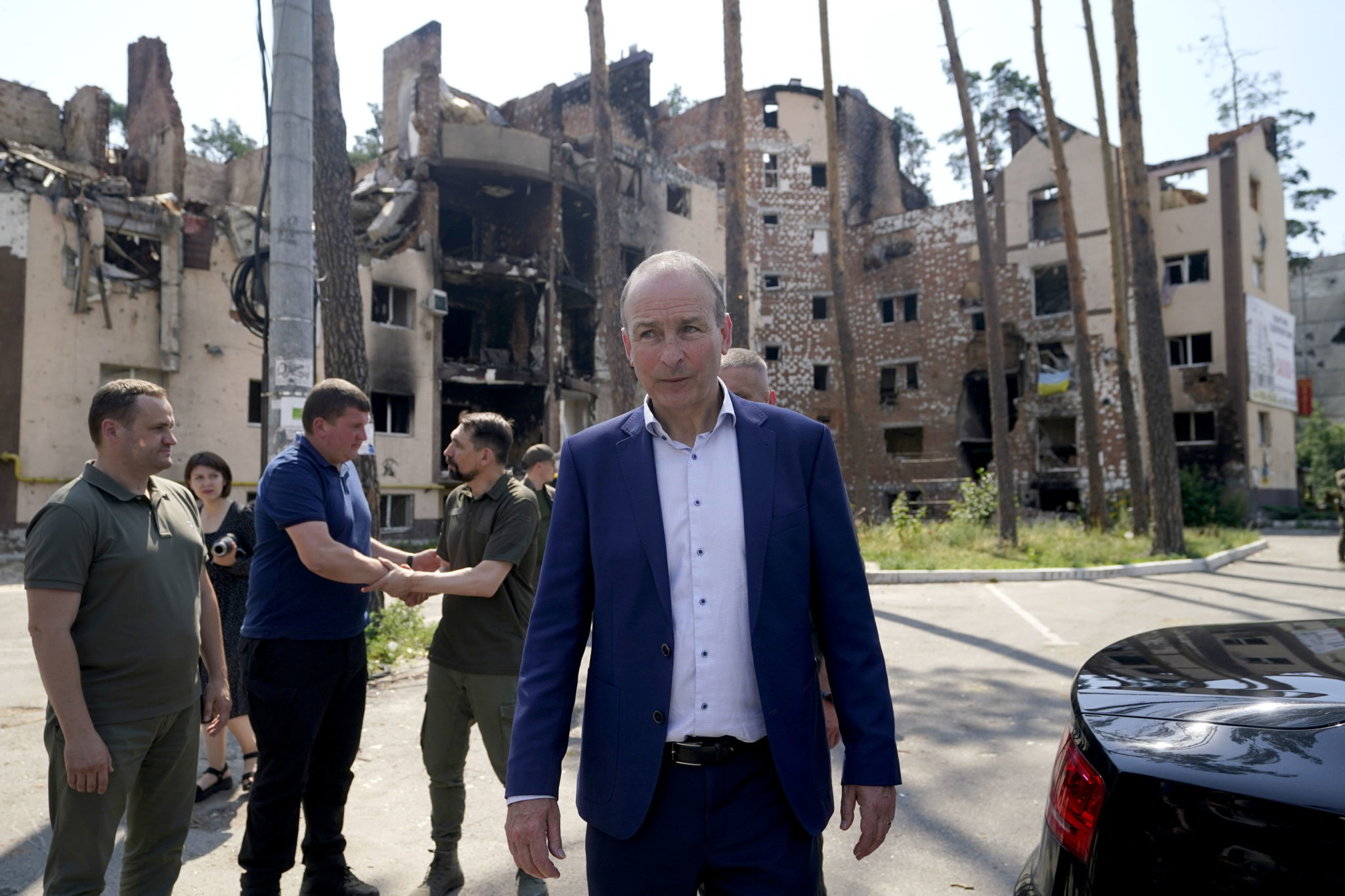 Taoiseach Micheal Martin speaks with local officials whilst viewing the damage to the city of Irpin, Ukraine