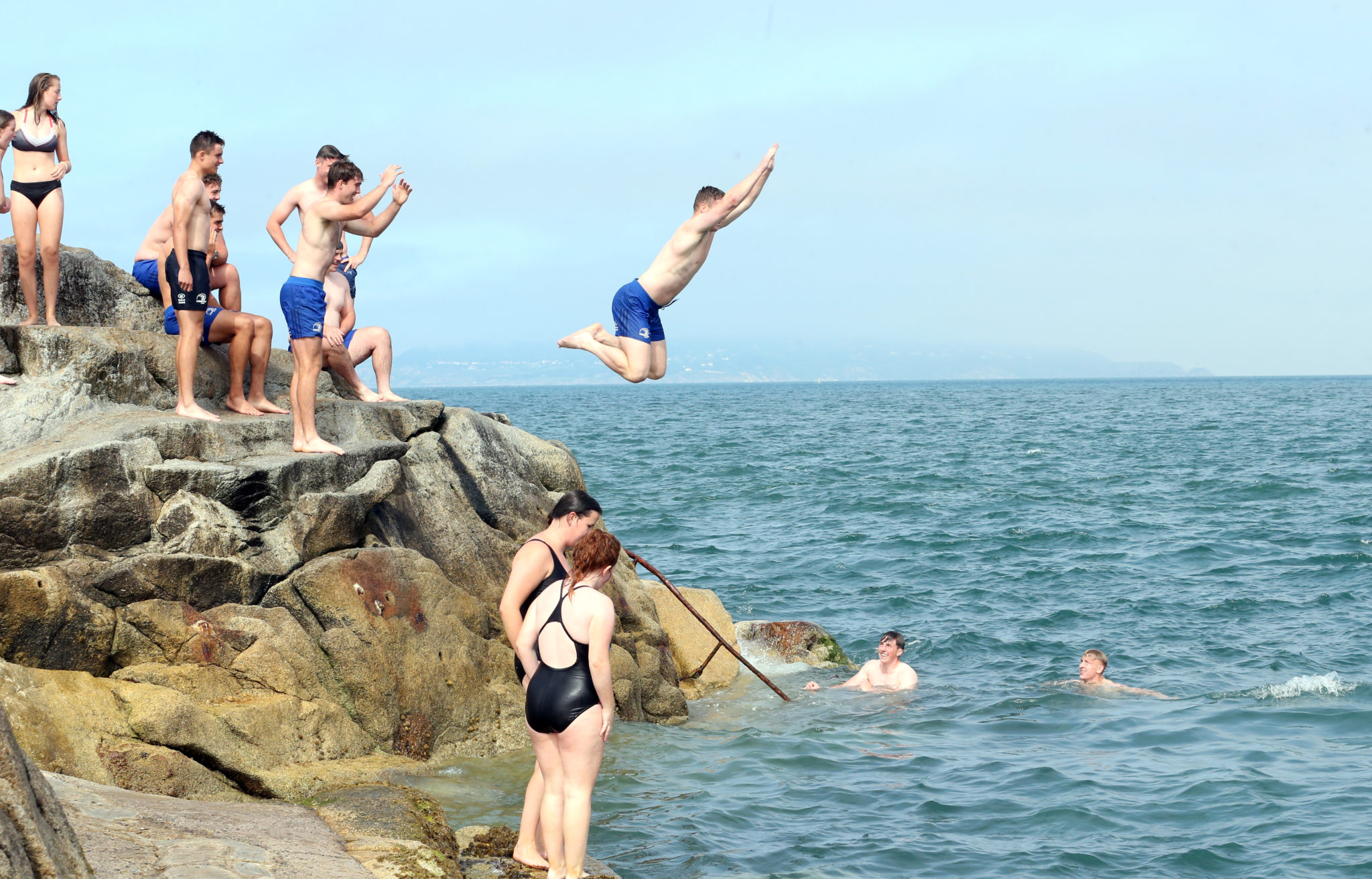 23/08/2021 Covid-19 Pandemic (Coronavirus), Ireland. Day 516 since start of lockdown. Day 106 of eased restrictions. People enjoy jumping in and swimming at the Forty Foot in Dublin as the warmer weather comes back. Photo: Sasko Lazarov/RollingNews.ie