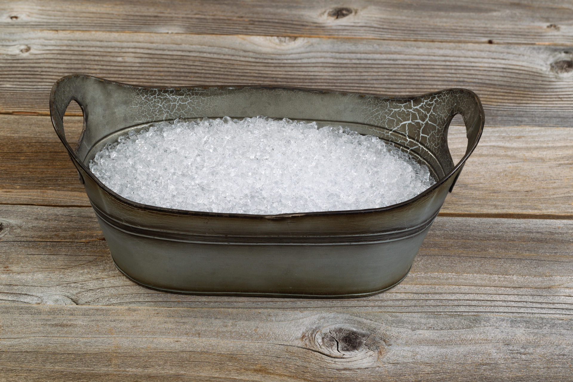 A vintage metal tub filled with ice - the precursor to the plug-in fridge.