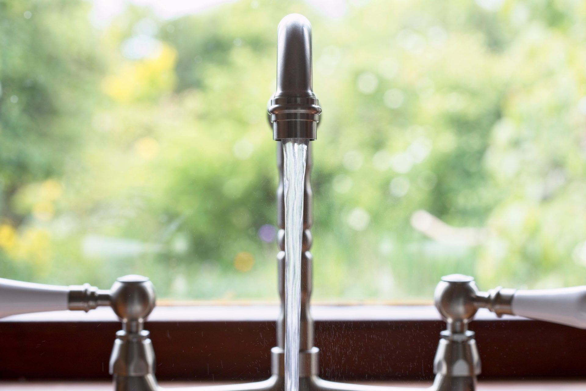 TB2F61 Kitchen taps left running and wasting water. Uk.
