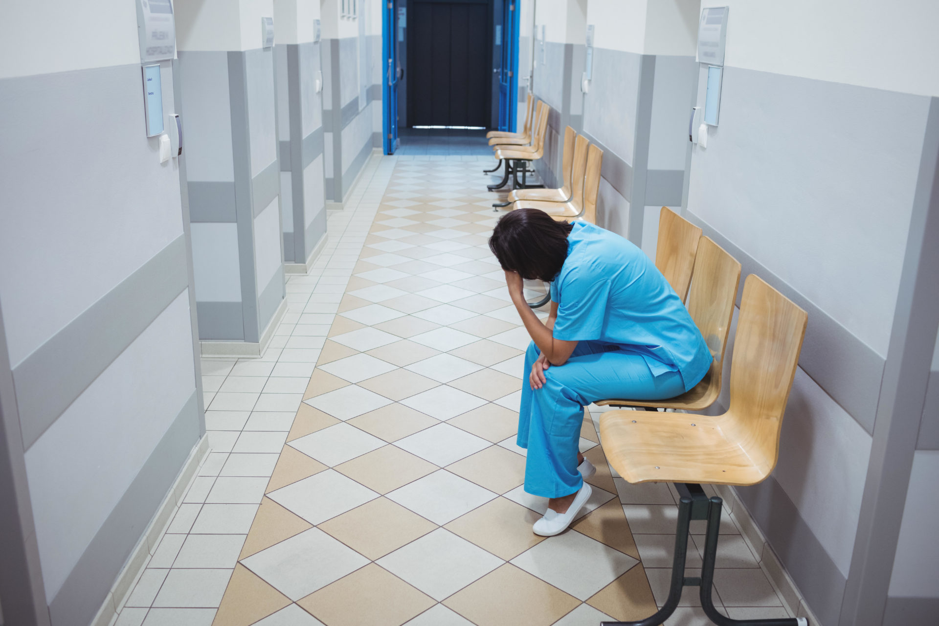 File photo of a nurse sitting on a chair.