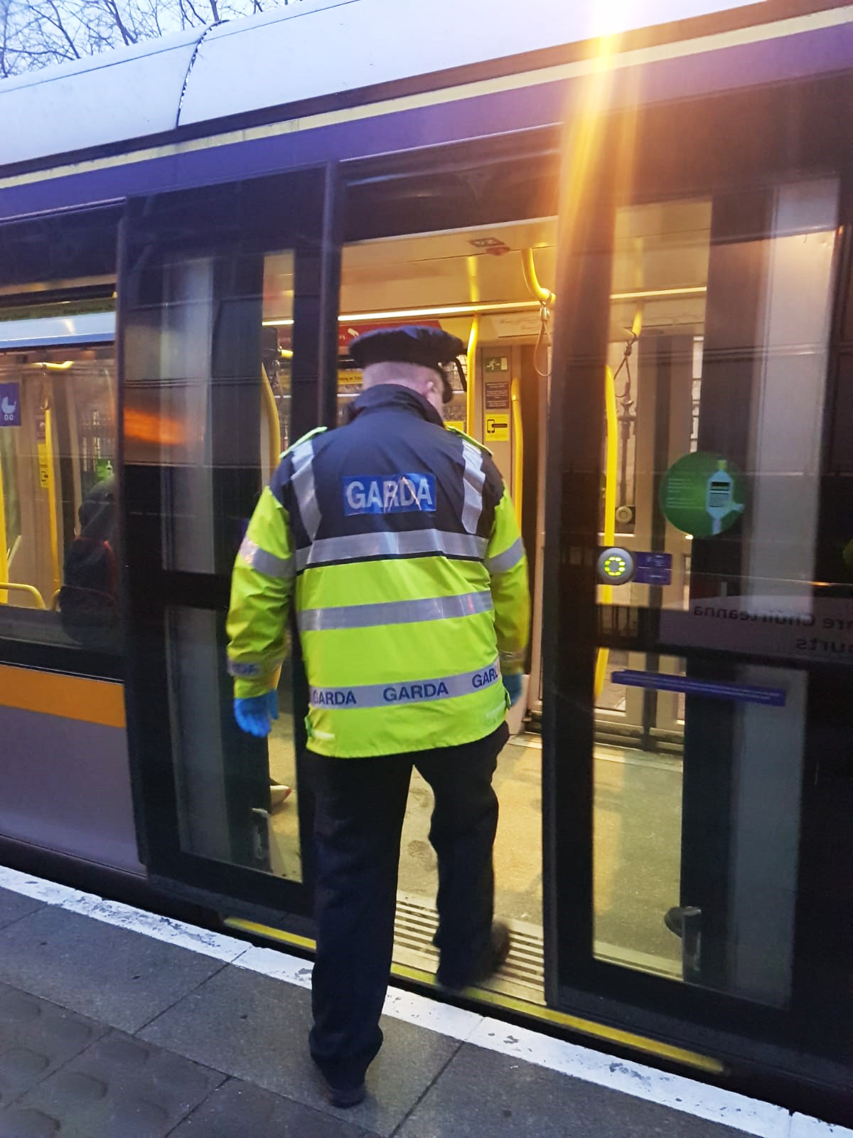 A Garda board a Luas tram in Dublin in February 2021