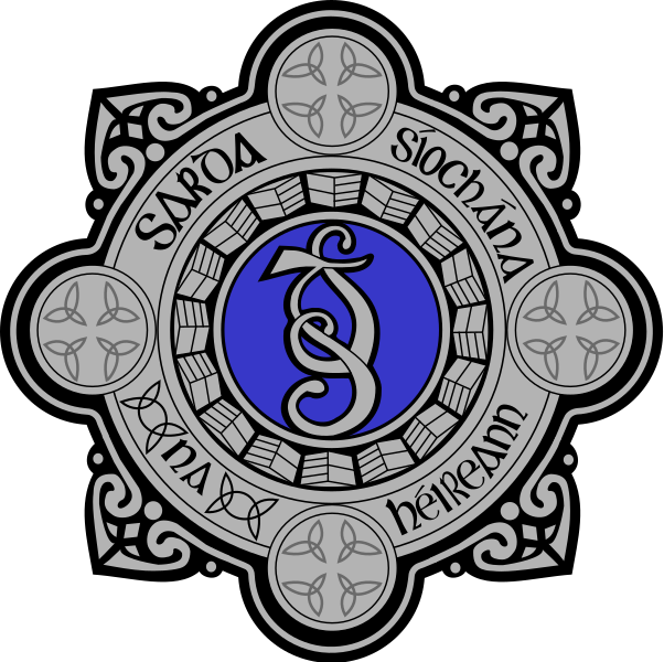 death. Image shows An Garda Síochána badge/crest.