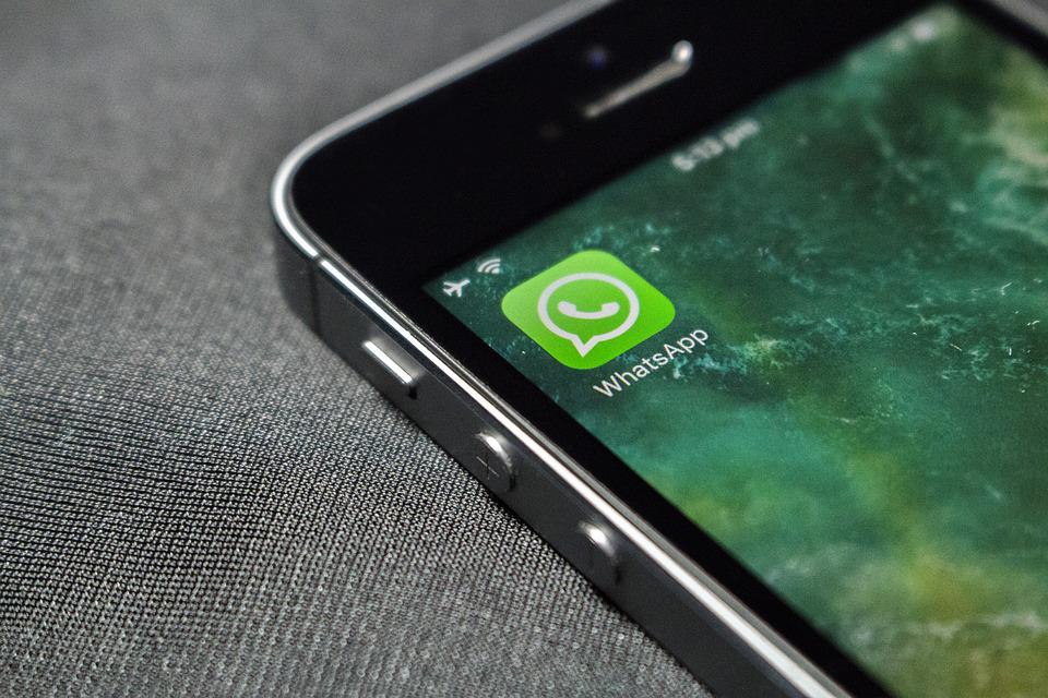 WhatsApp. Image shows the top left corner of a smartphone displaying the WhatsApp icon, which is a green square with a white speech bubble surrounding a white telephone symbol.