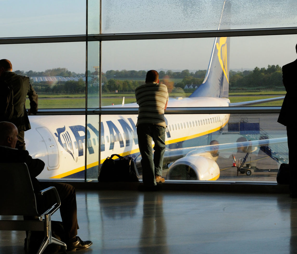 Passengers wait to board a 'redeye' early morning flight at Dublin Airport in May 2010.