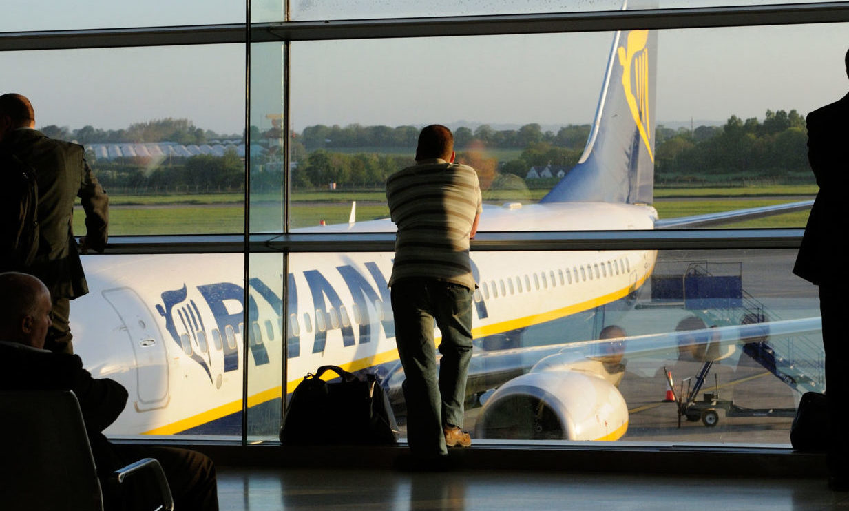 Passengers wait to board a 'redeye' early morning flight at Dublin Airport in May 2010.