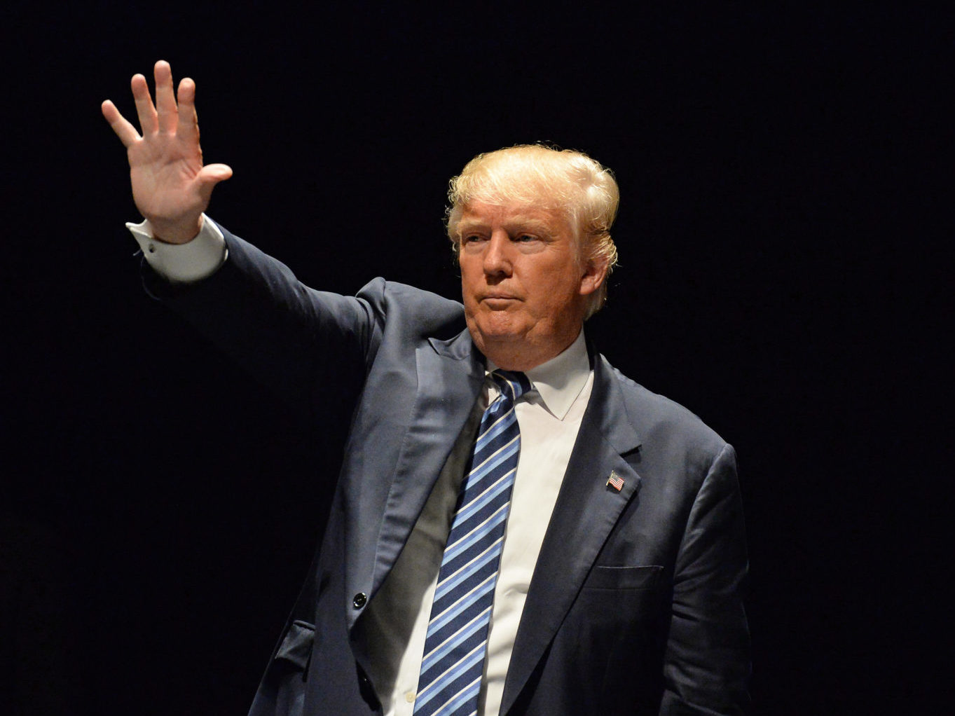 Donald Trump salutes supporters in Saint Louis, Missouri in March 2016.