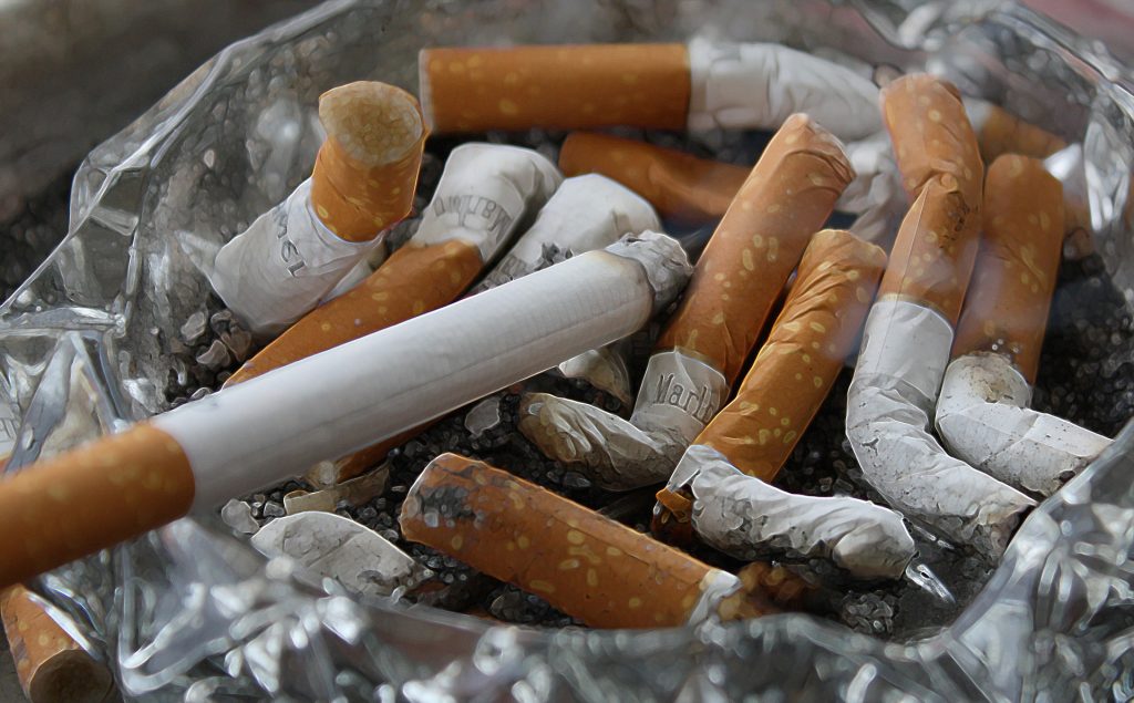 cigarettes. Image shows a number of half-smoked cigarettes in an ashtray.