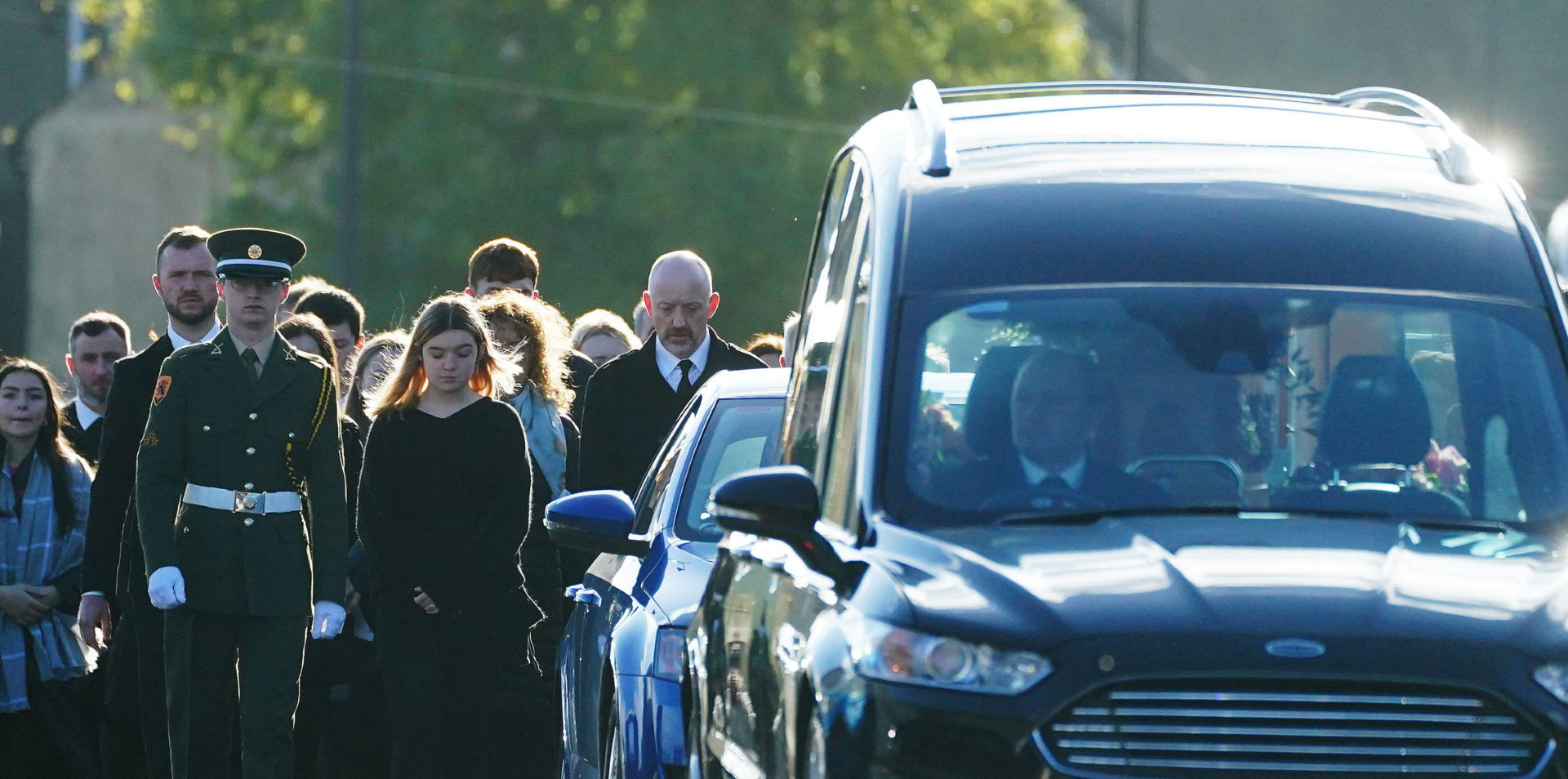 Family and mourners walk behind the hearse carrying the coffin of 49-year-old mother of four Martina Martin, 13-10-2022. Image: PA Images / Alamy