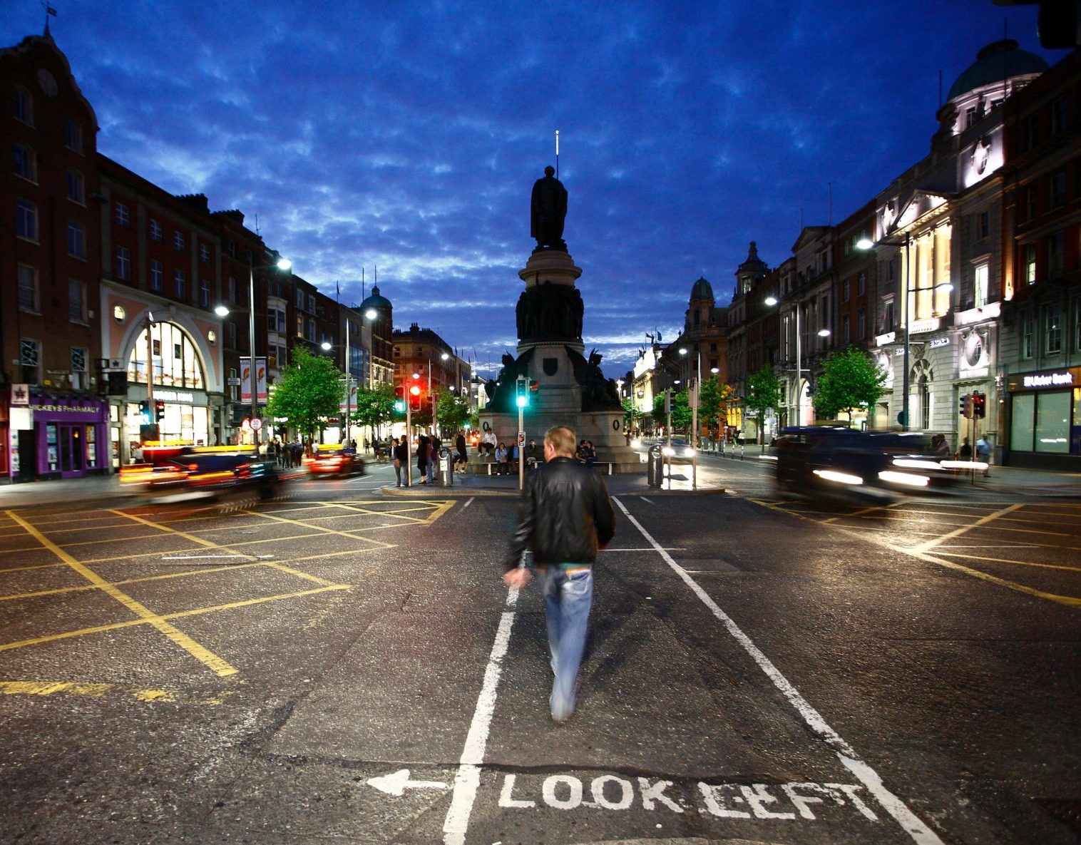 A man walks onto O'Connell Street in Dublin city centre in June 2010.