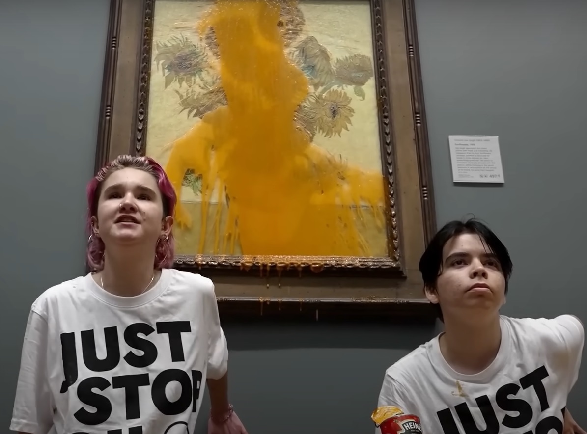 Activists speak after throwing soup on Vincent van Gogh's 'Sunflowers' at the National Gallery in London, England. 