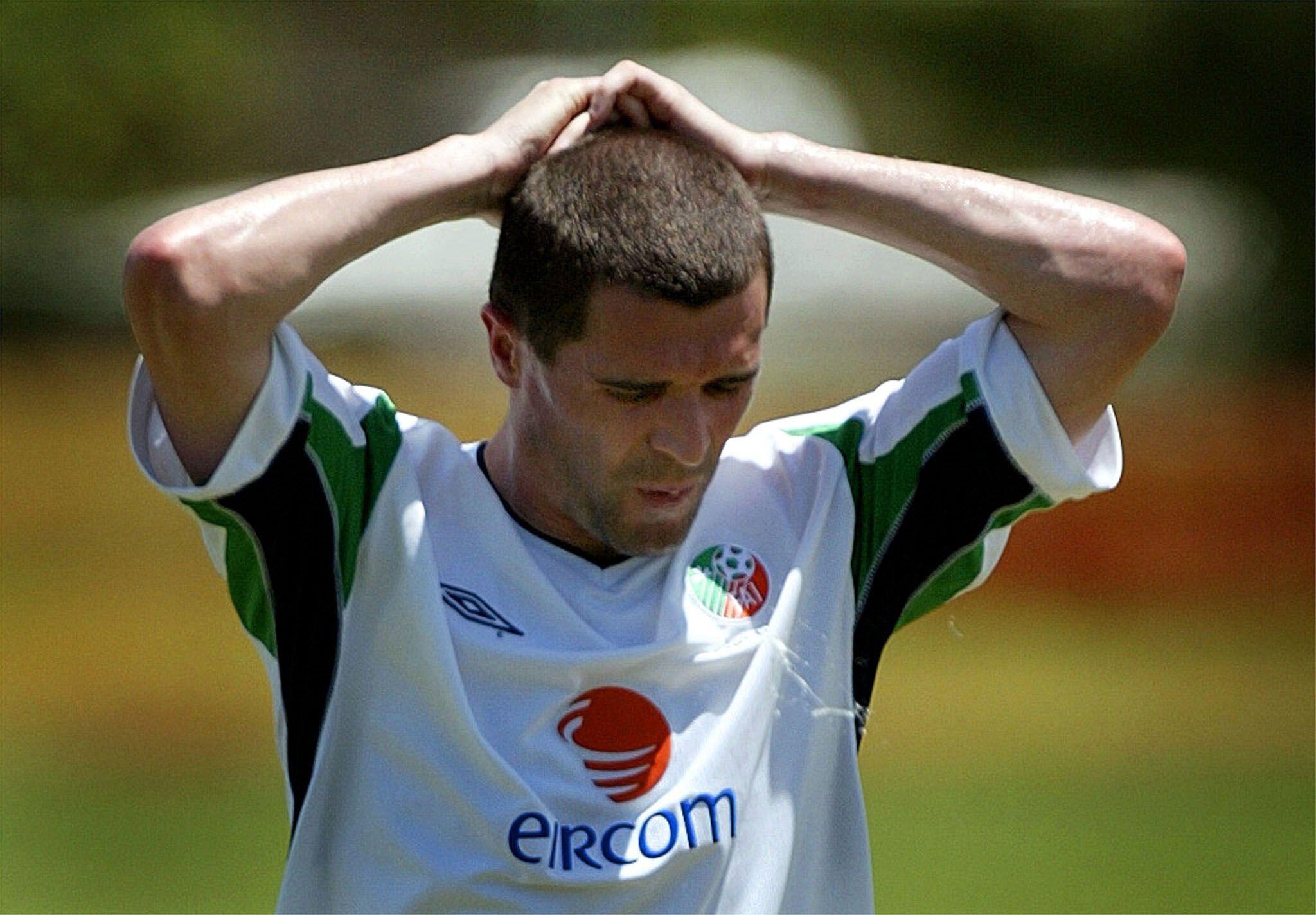 Republic of Ireland captain Roy Keane holds his head after a sprint during a training session in Saipan