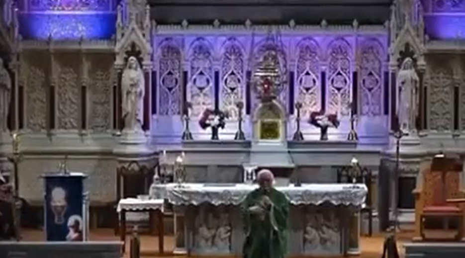 Fr Sean Sheehy on the altar of St Mary's Church in Listowel, Co Kerry